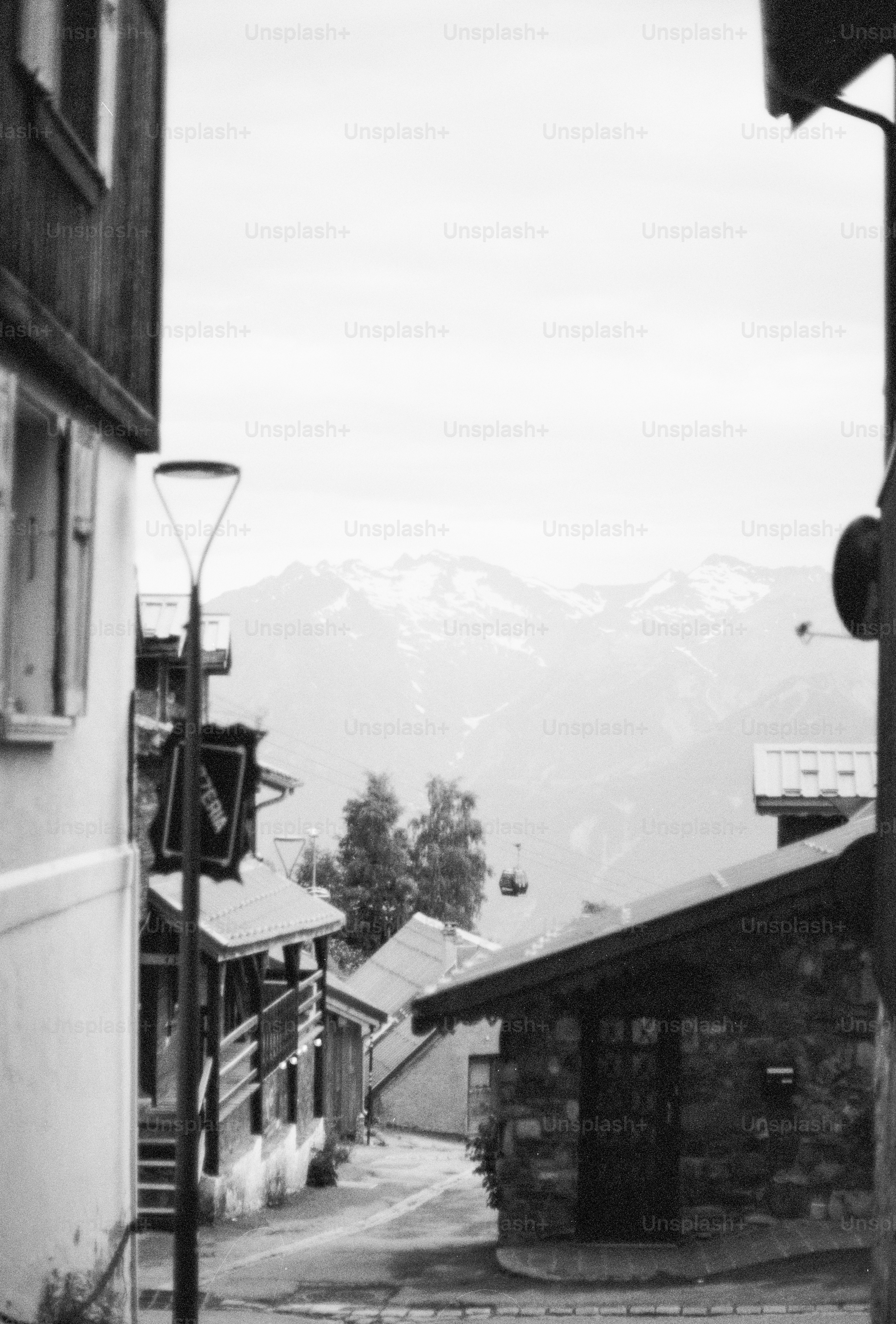 Alpine village street leading to mountains