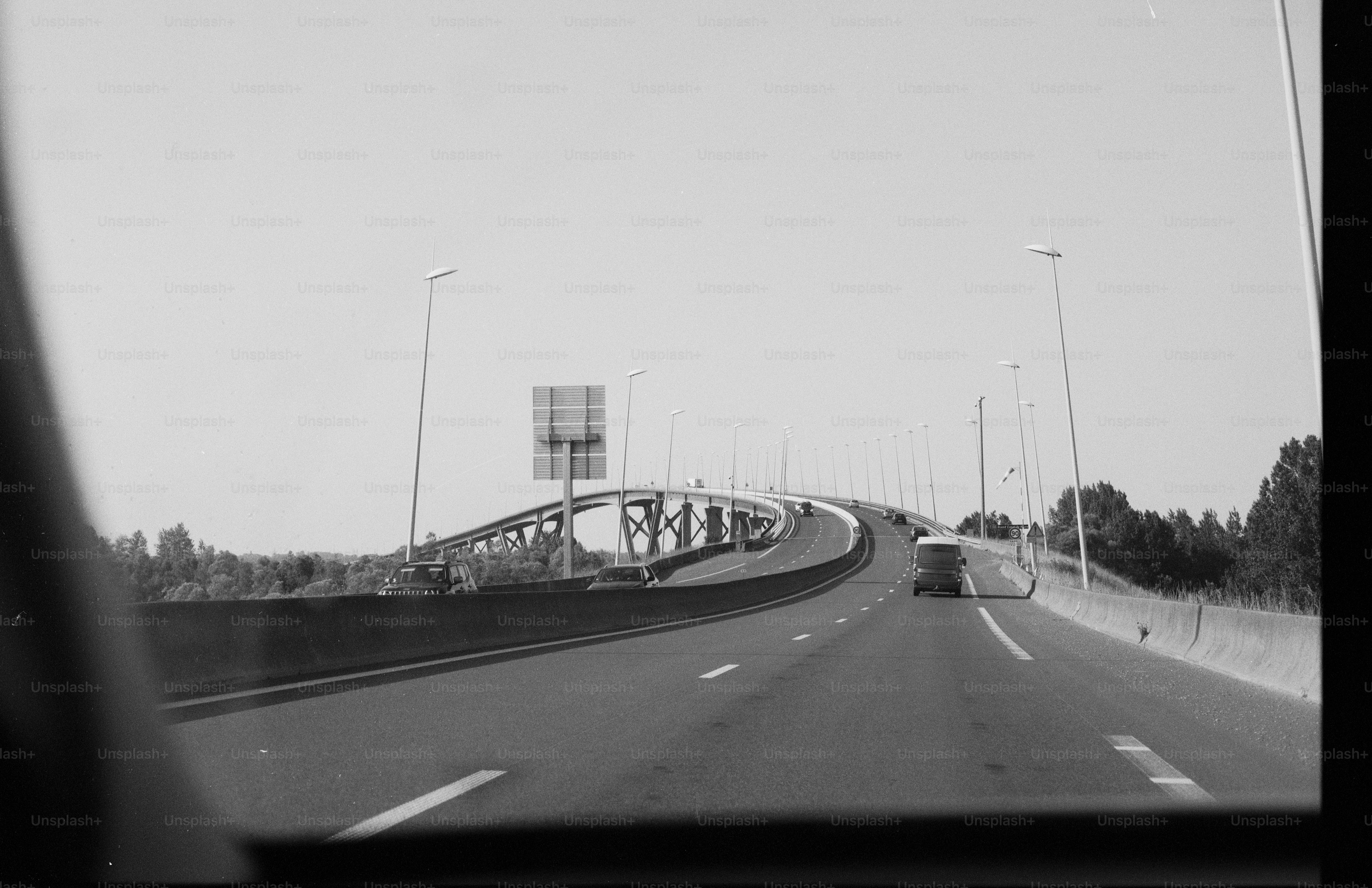 Black and white highway with curving overpass