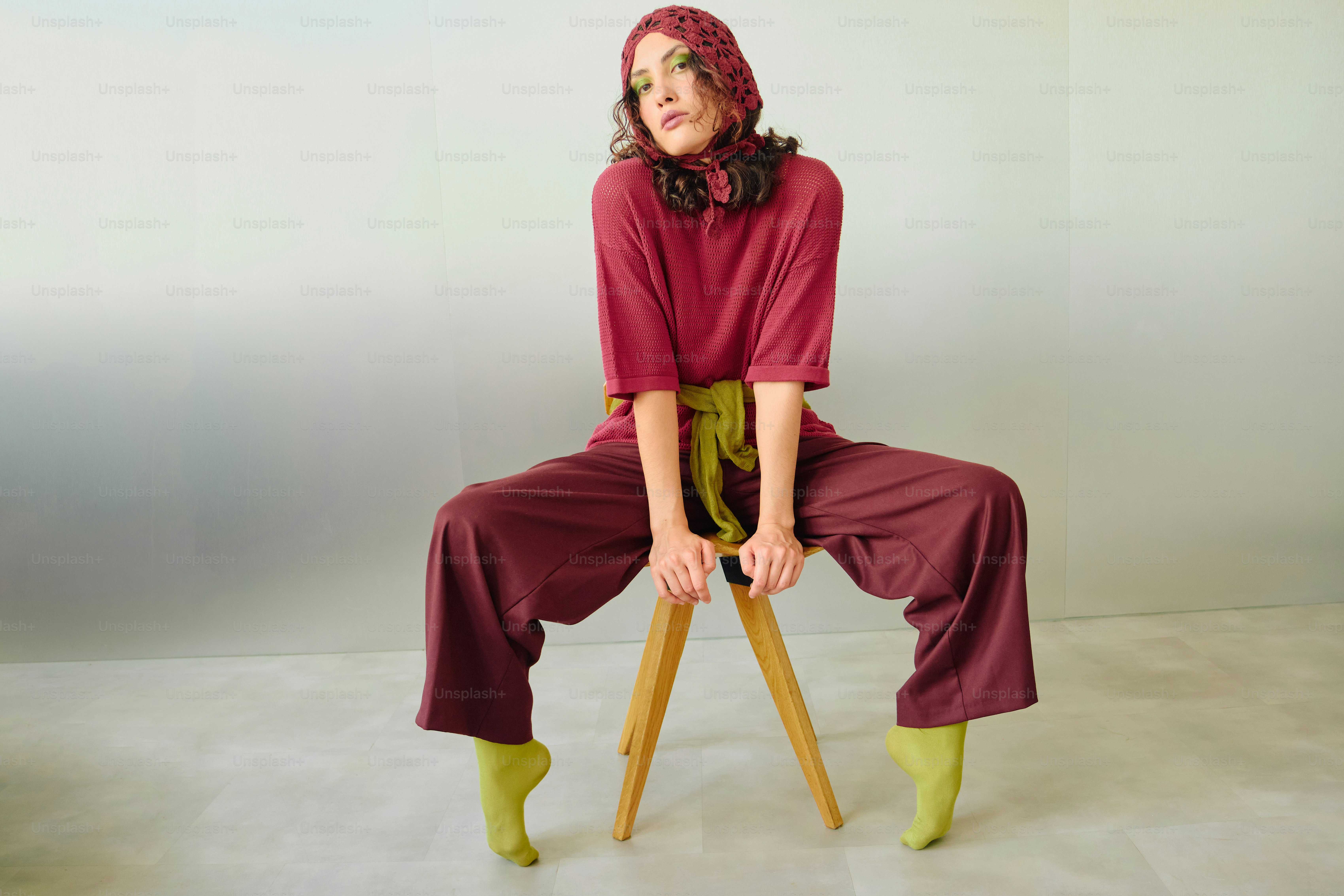 Woman posing in burgundy and chartreuse fashion