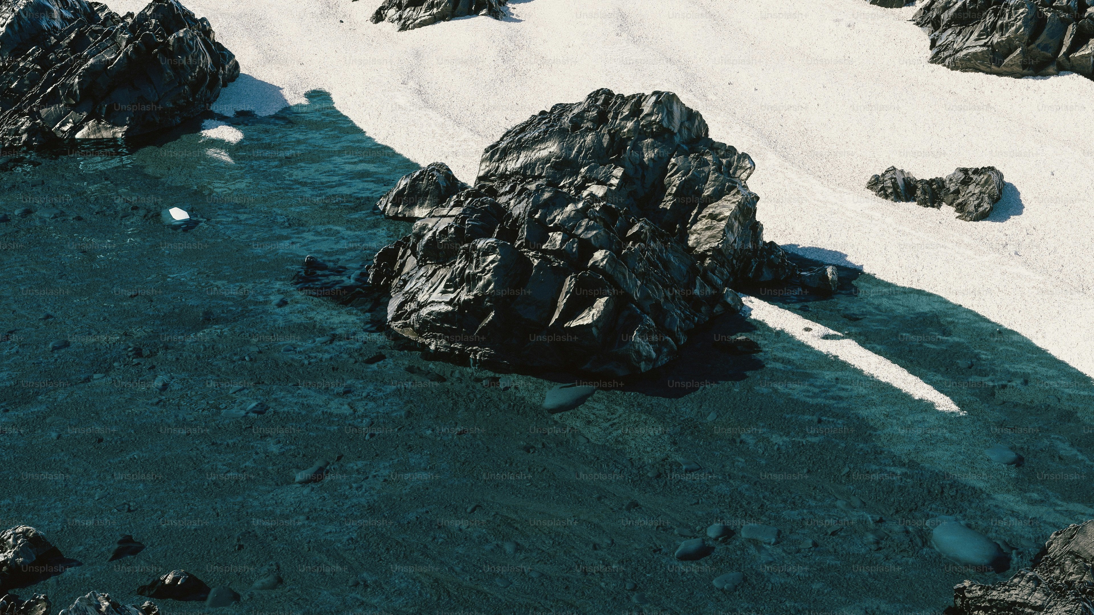 Rocky coast with clear blue water and bright sand