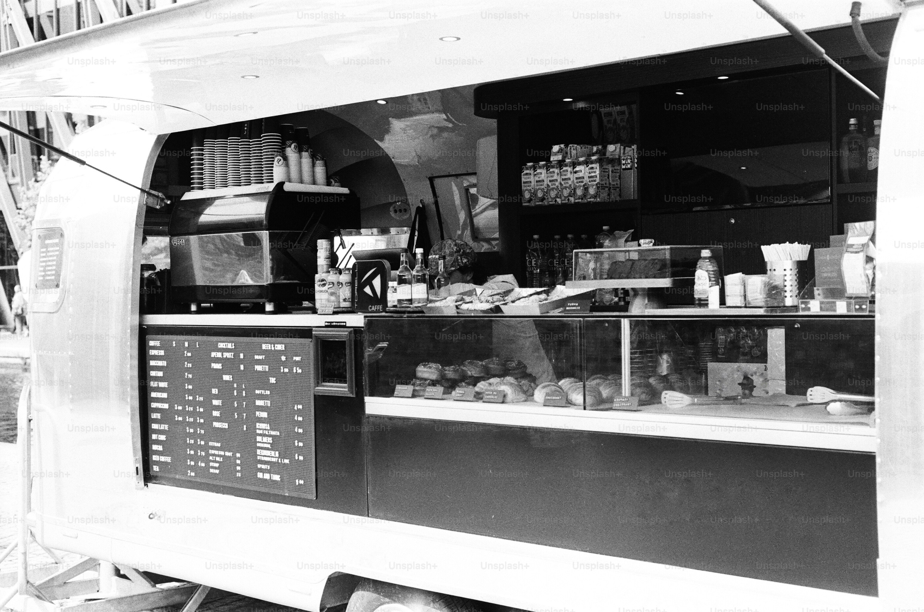 Coffee trailer with menu and pastries at paddington basin