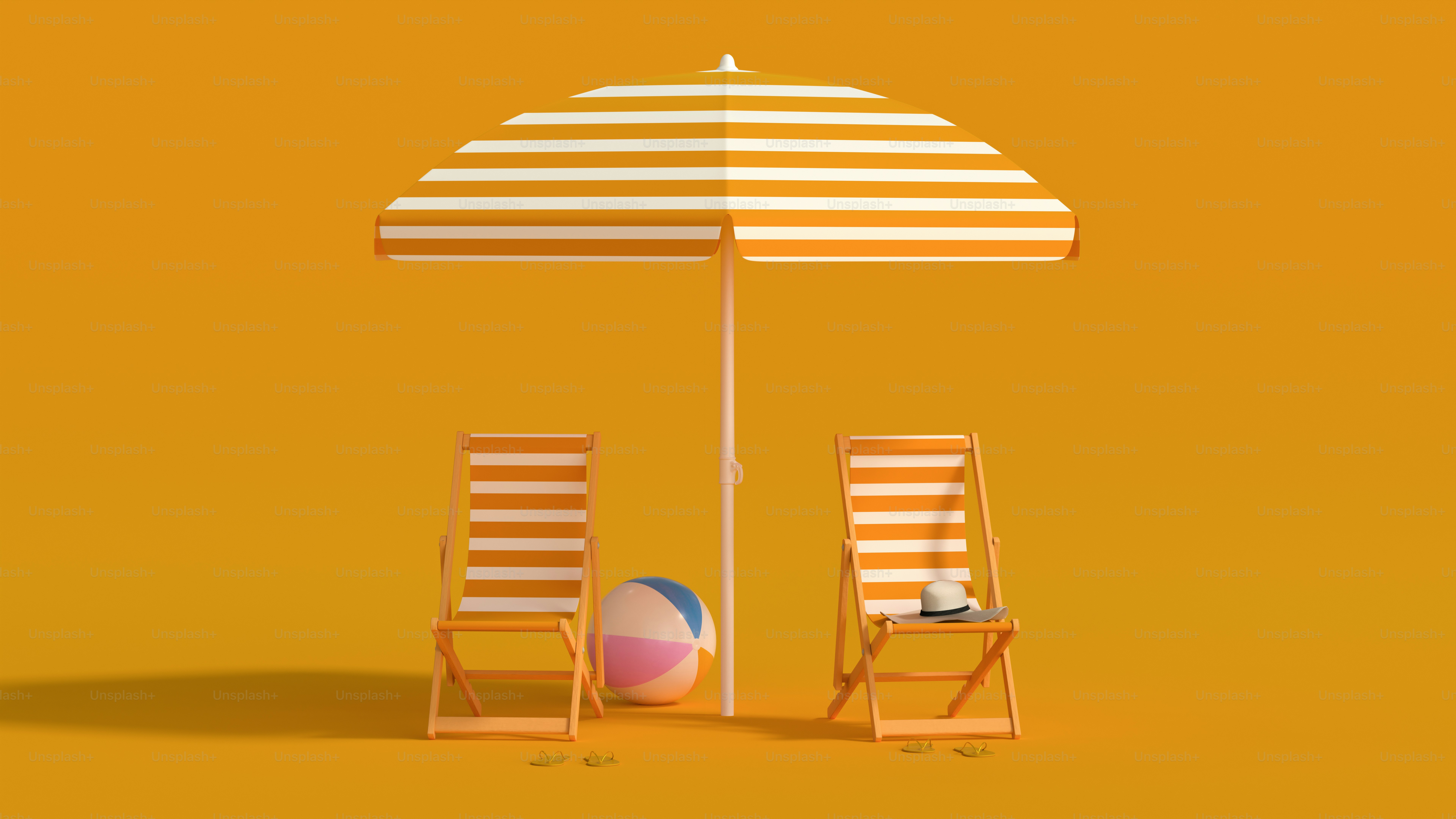 Striped beach chairs, umbrella, and ball against orange