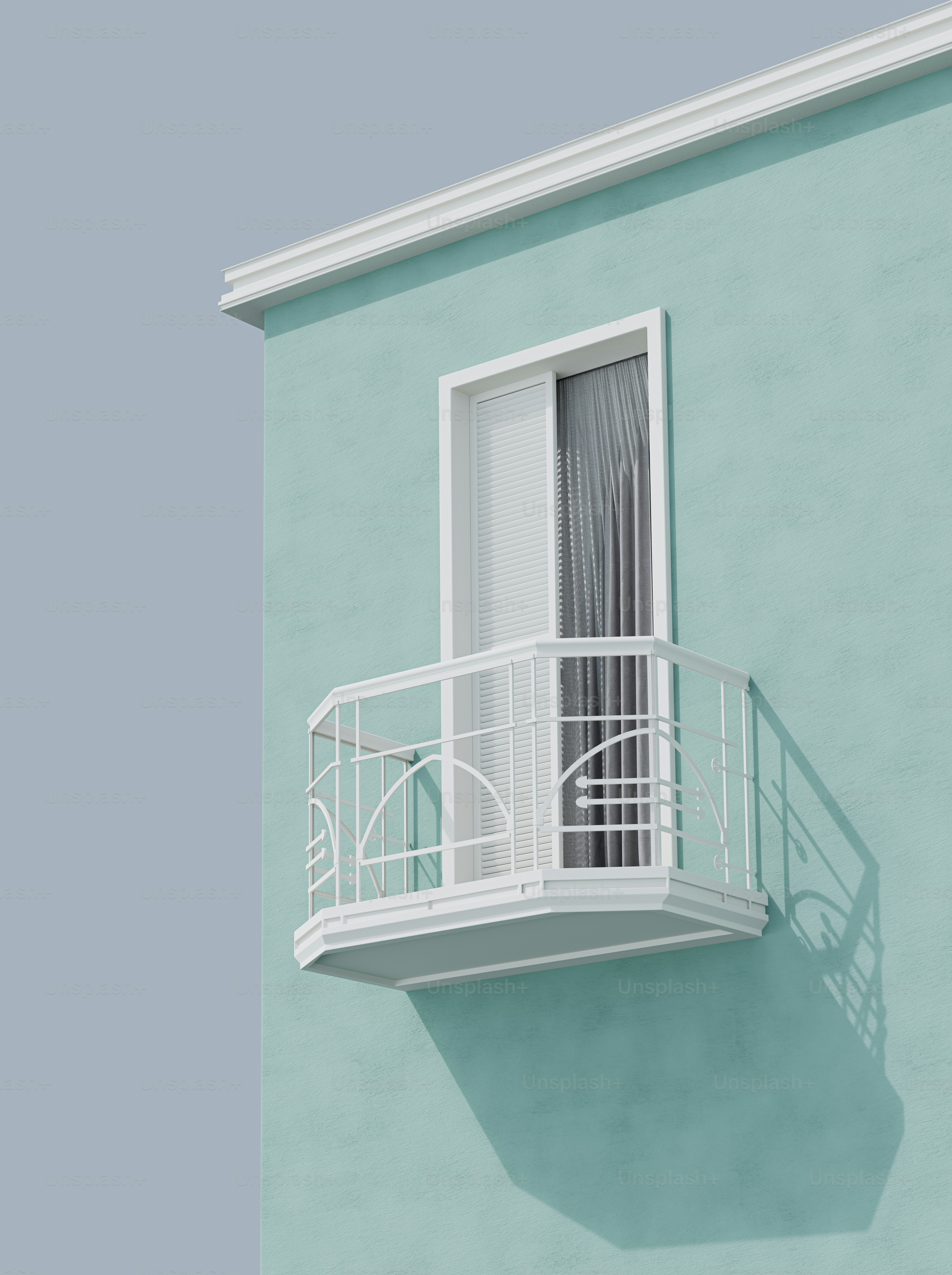 White balcony casting shadow on mint green building