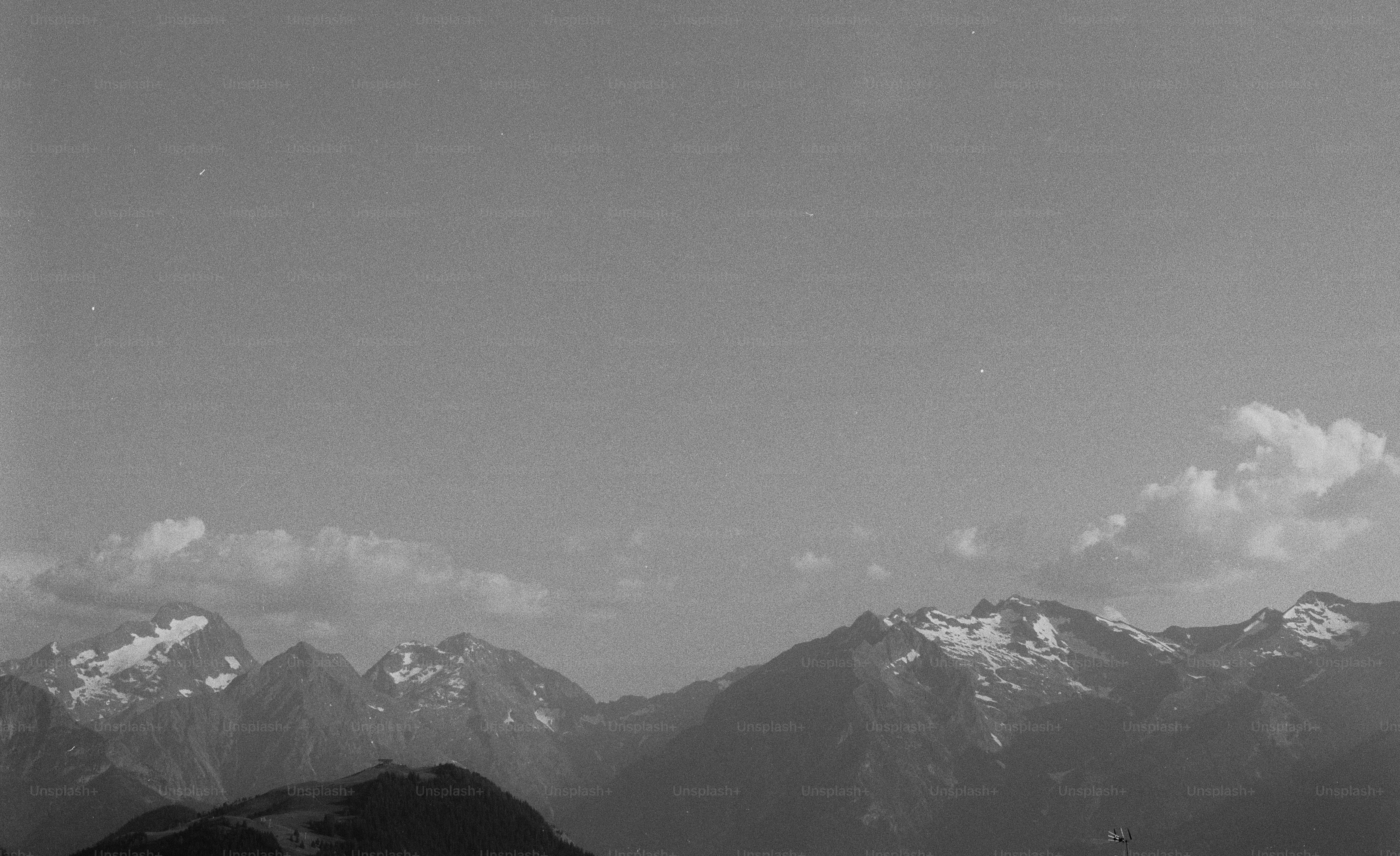 Snow-capped mountains under a clear sky