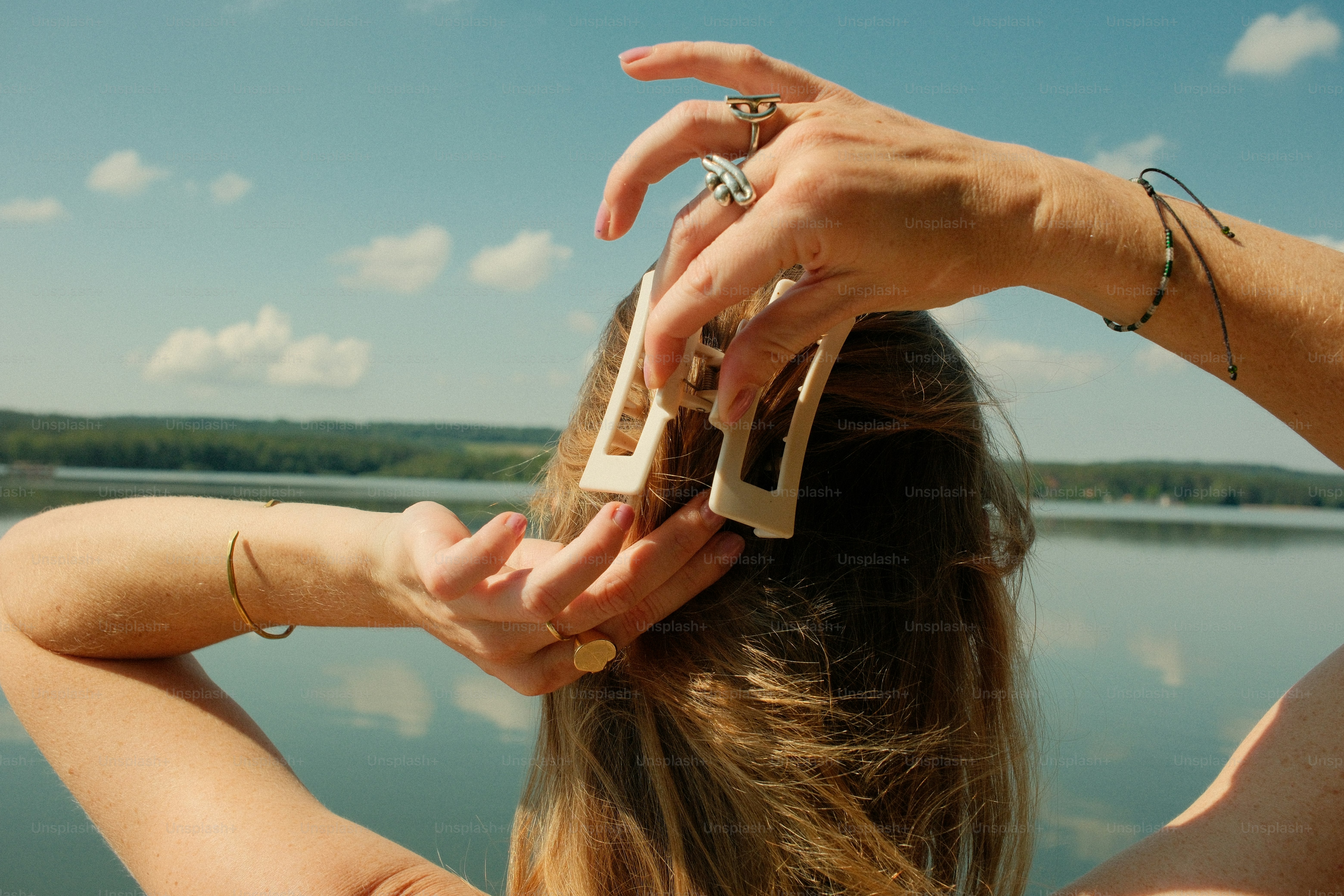 Claw clip styling hair by lake