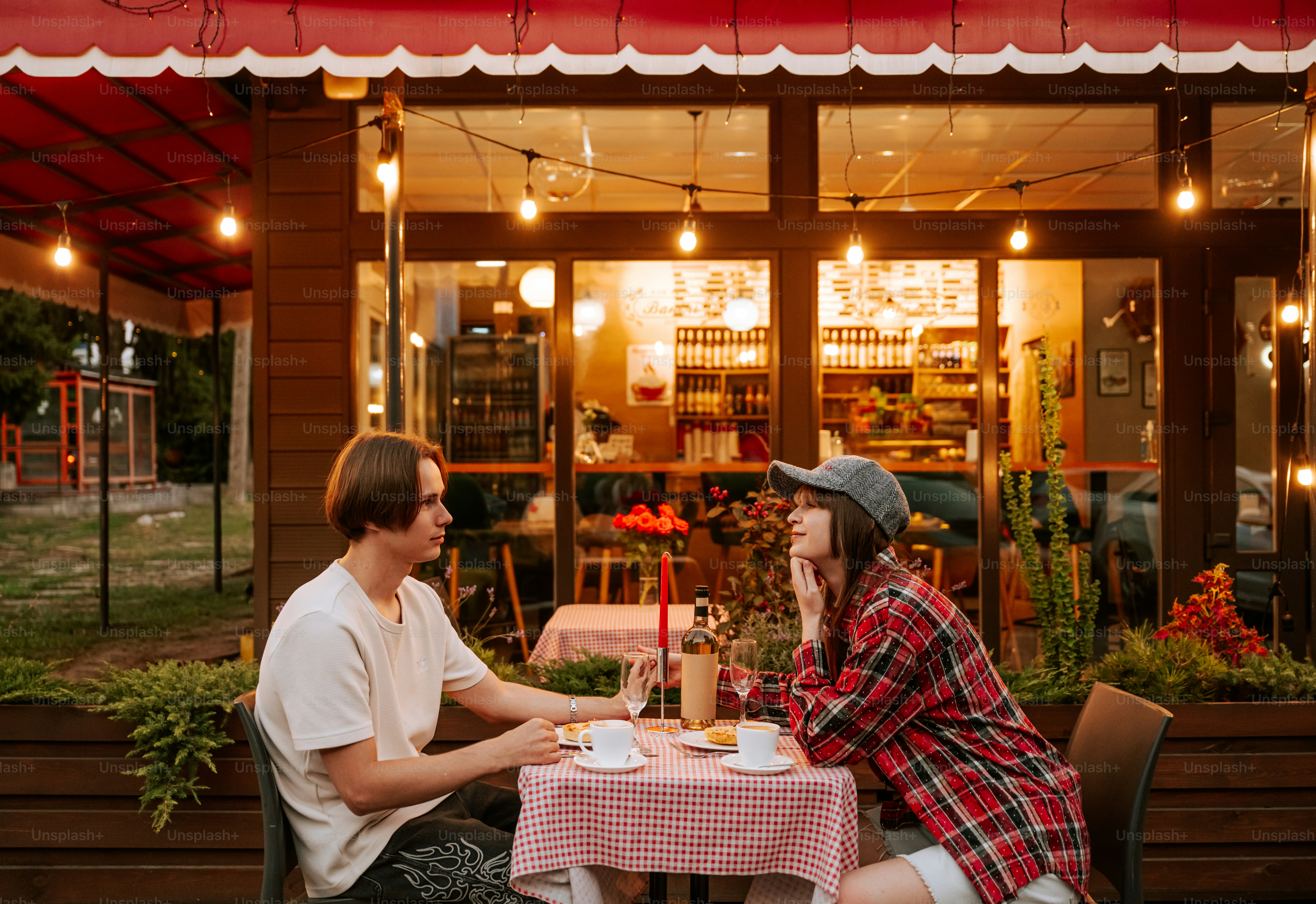 Young couple conversing at an outdoor cafe