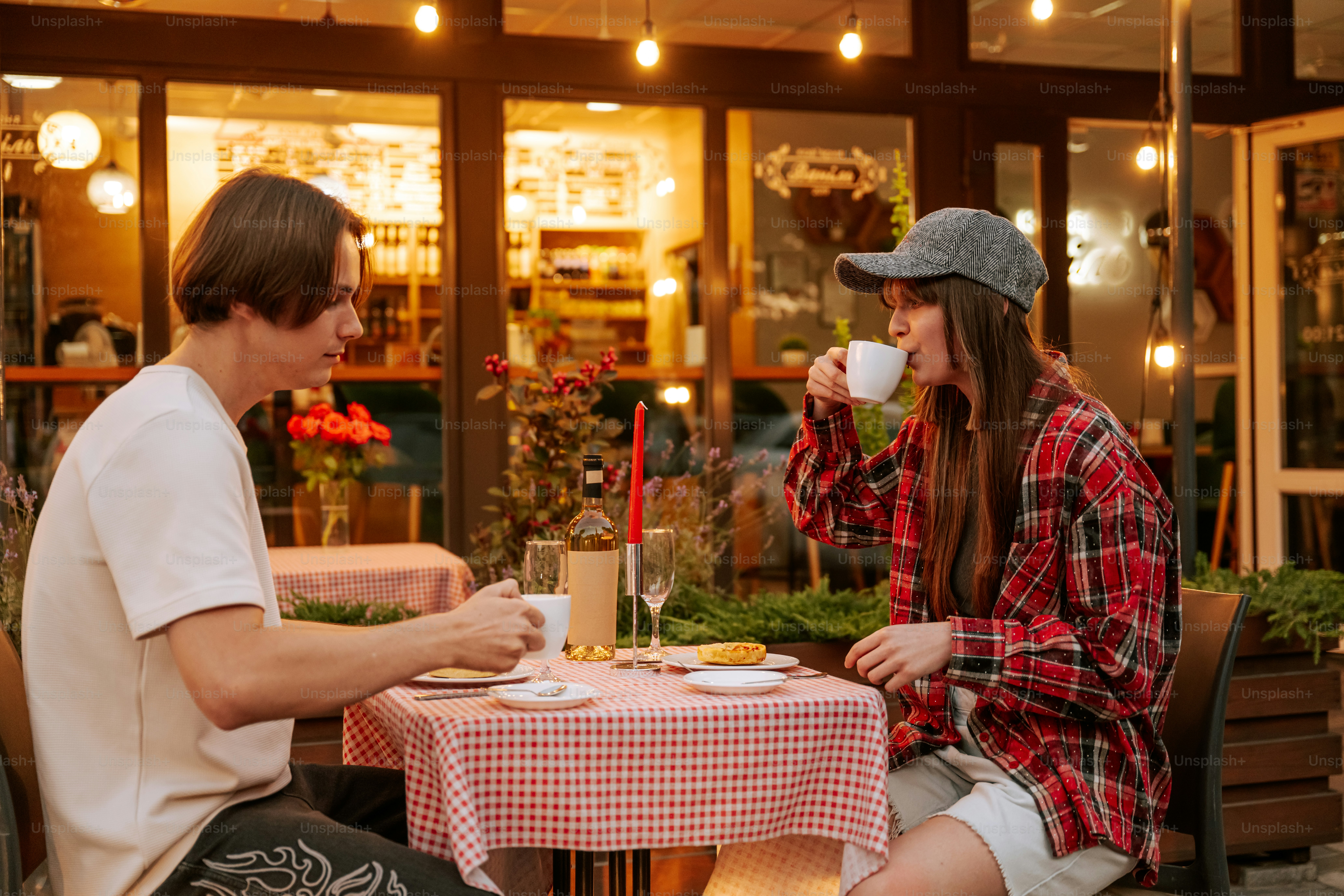 Couple drinking coffee at an outdoor cafe