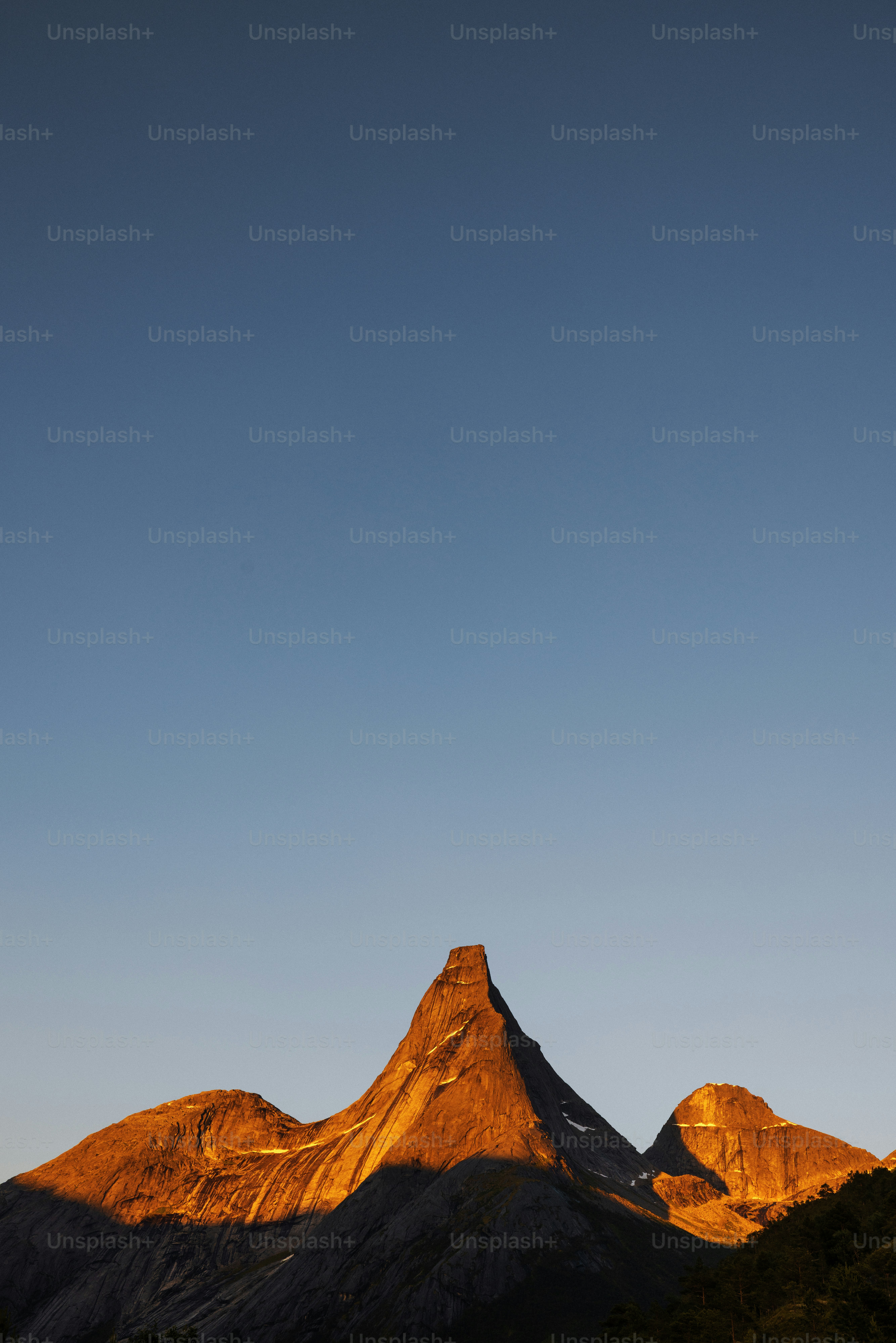 Mountain peak bathed in golden sunset light