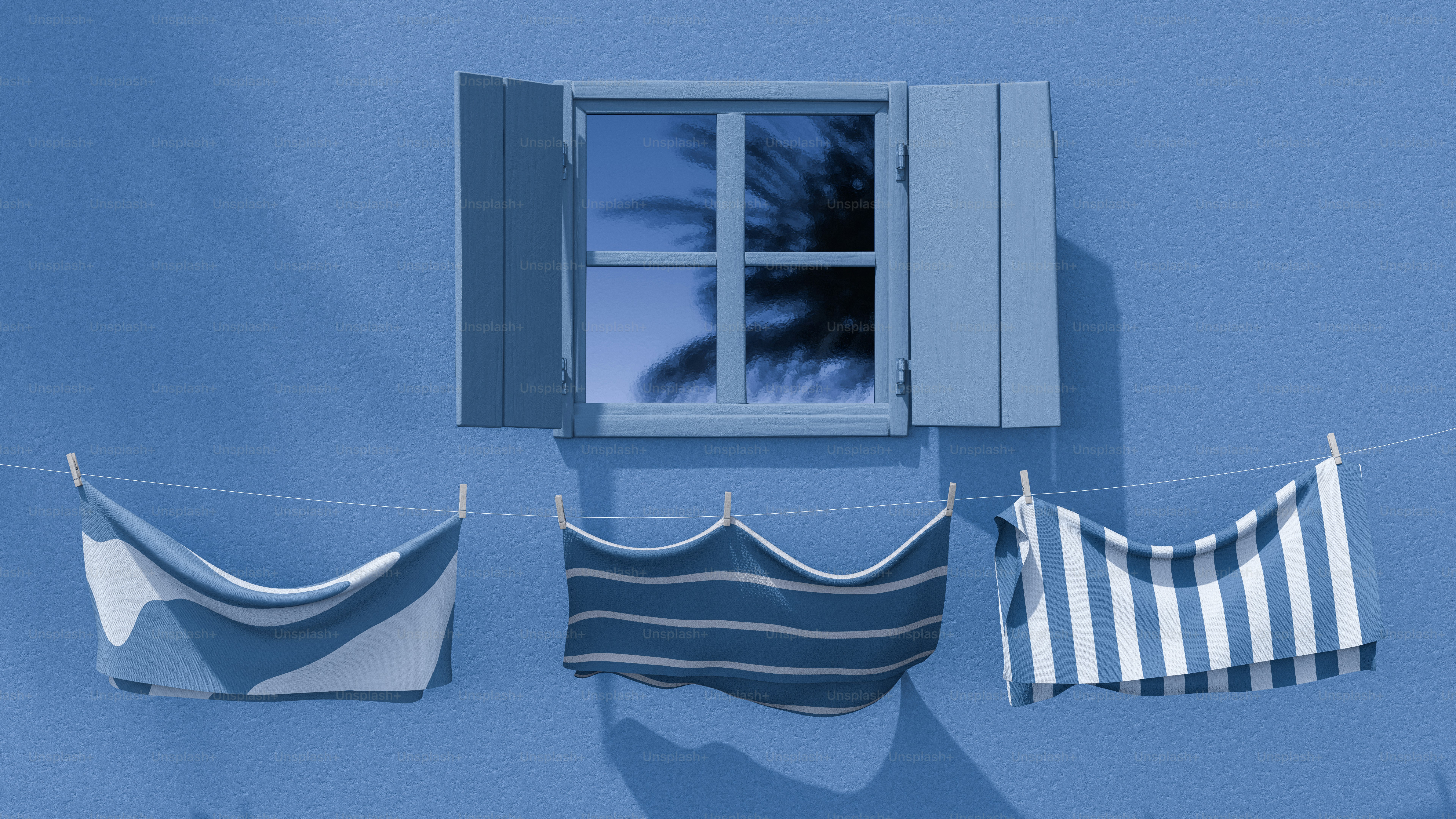 Blue wall with window and laundry drying
