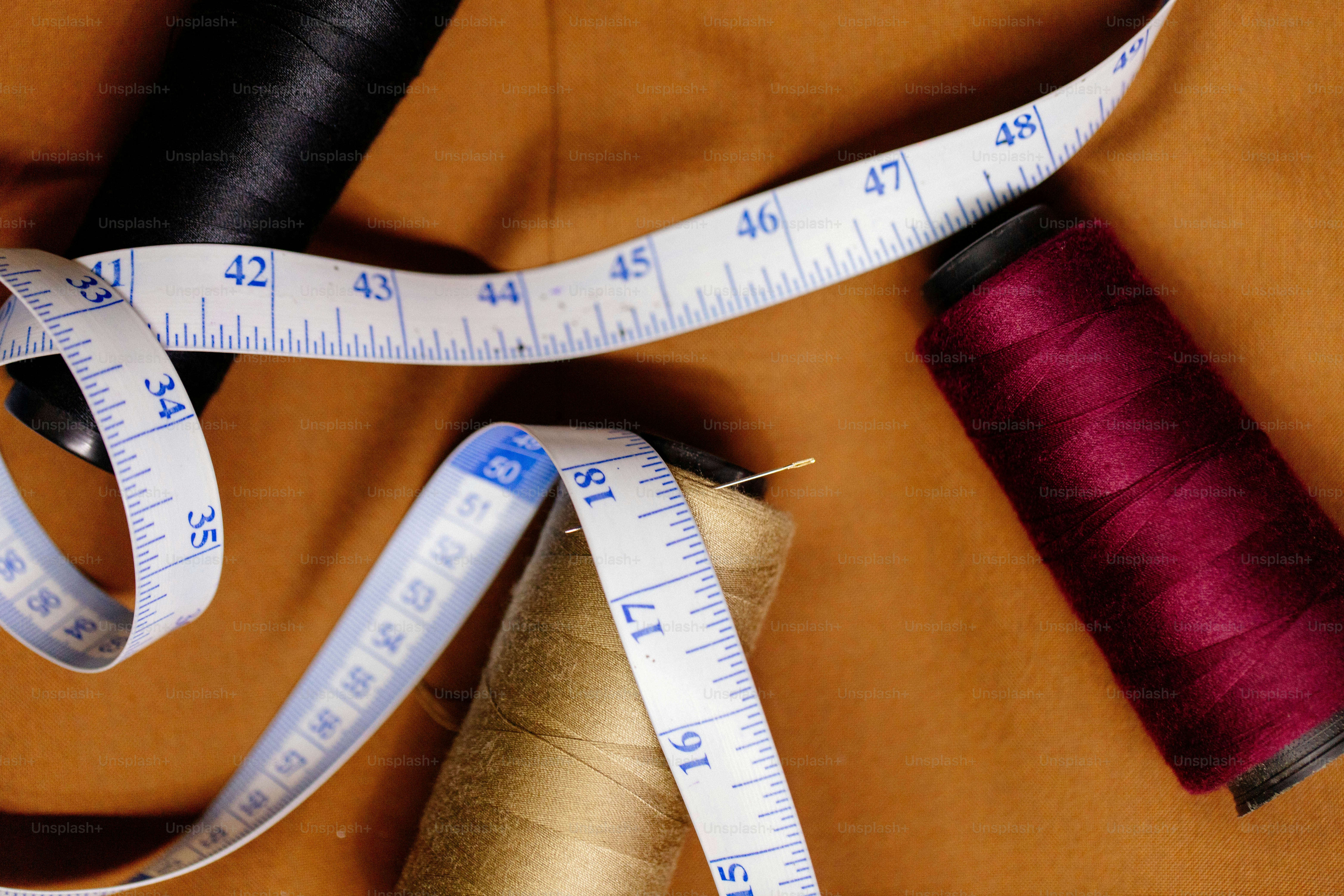 Spools of sewing thread and measuring tape