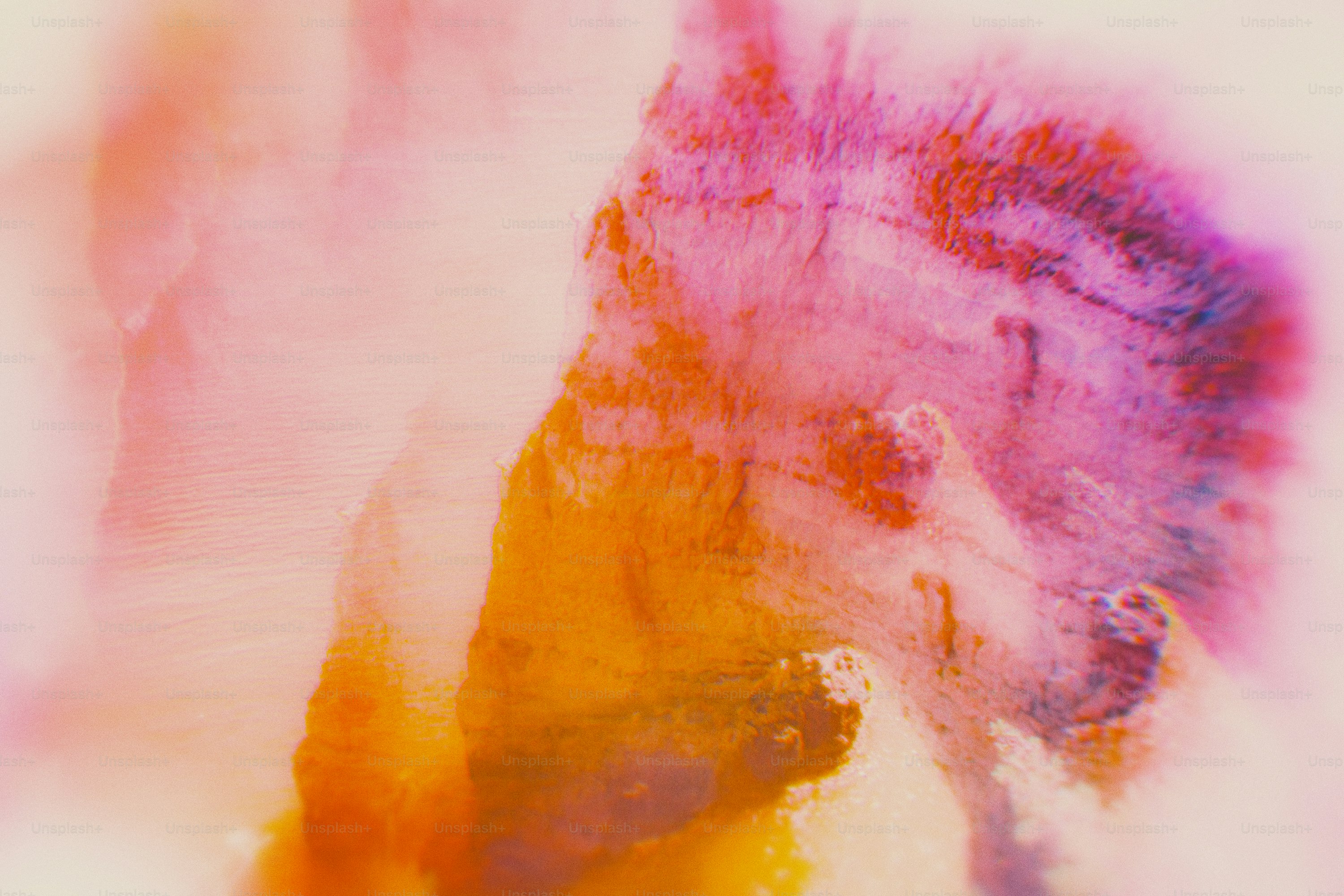 Soft abstract watercolor with pink, orange, and purple hues