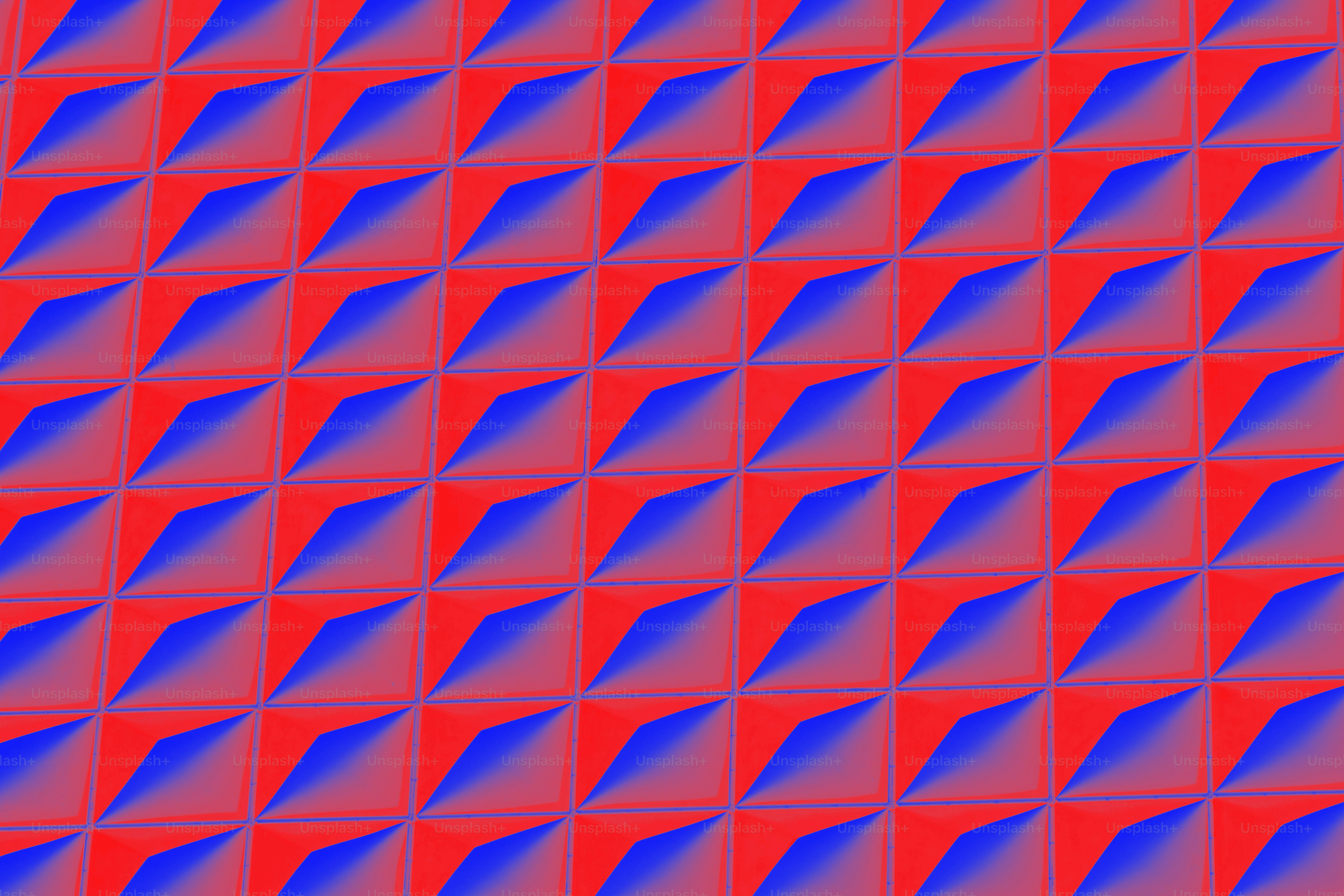 Pola geometris merah dan biru menciptakan efek 3D