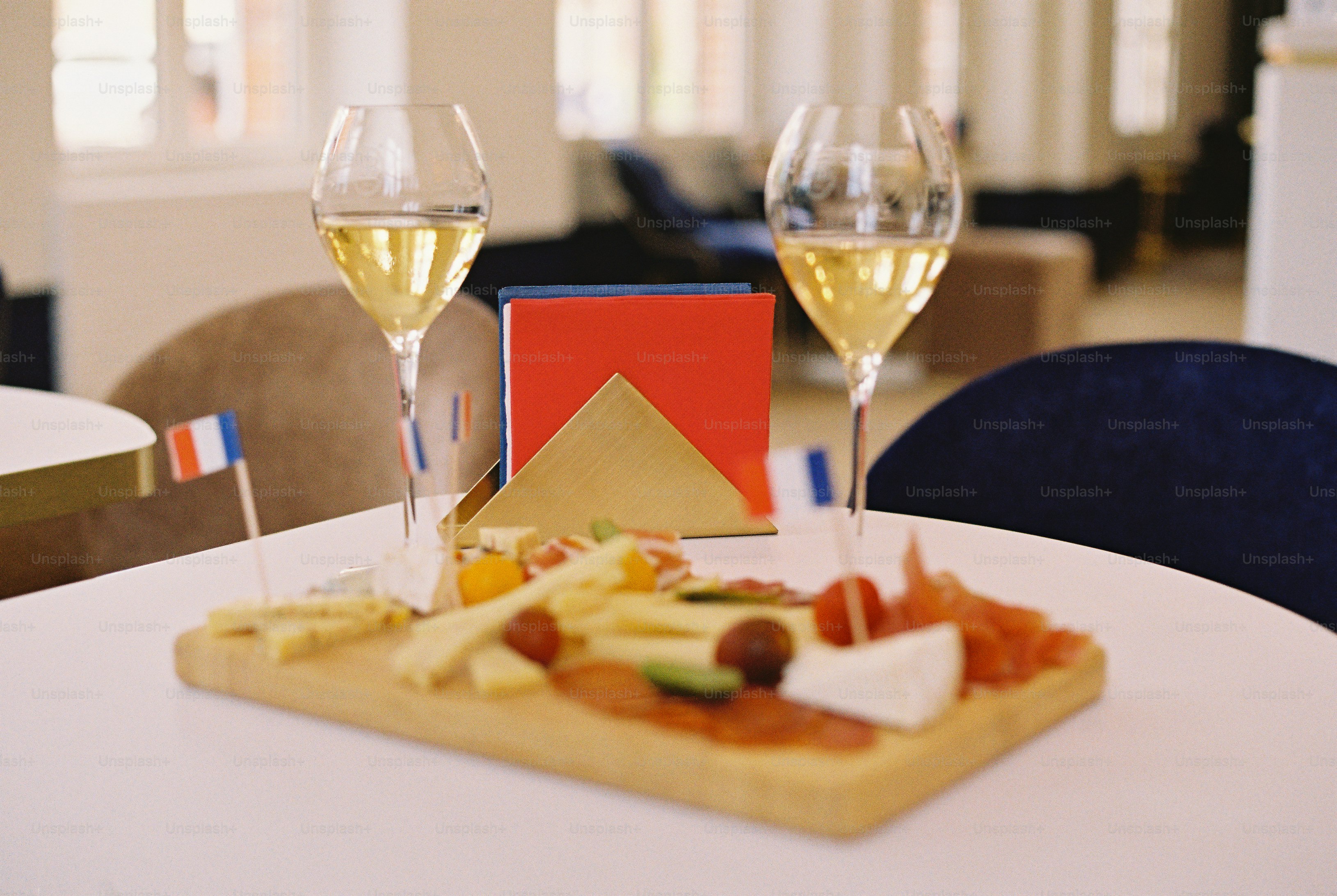 White wine and cheese platter with french flags