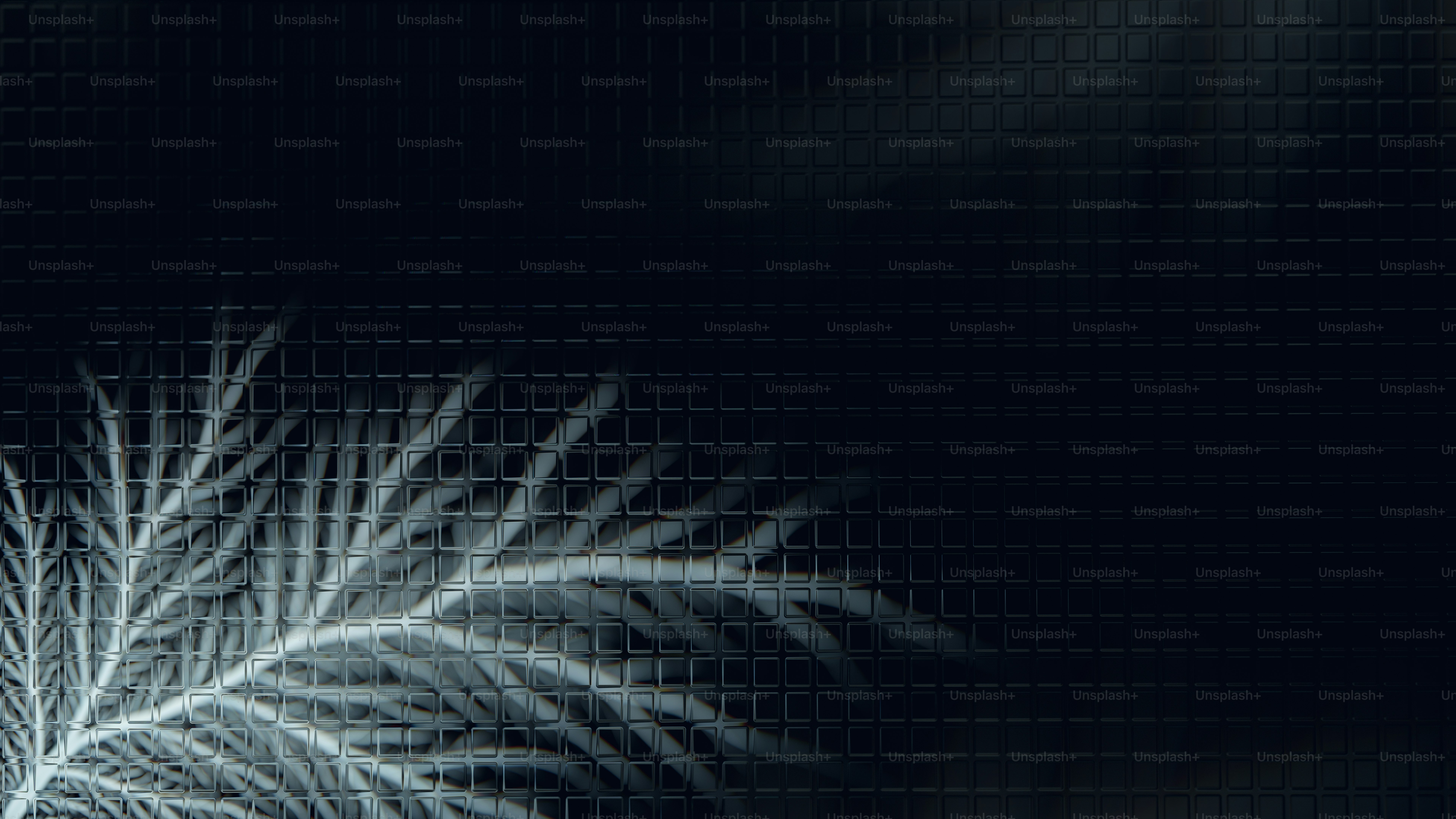Glowing white fractal pattern on dark grid background