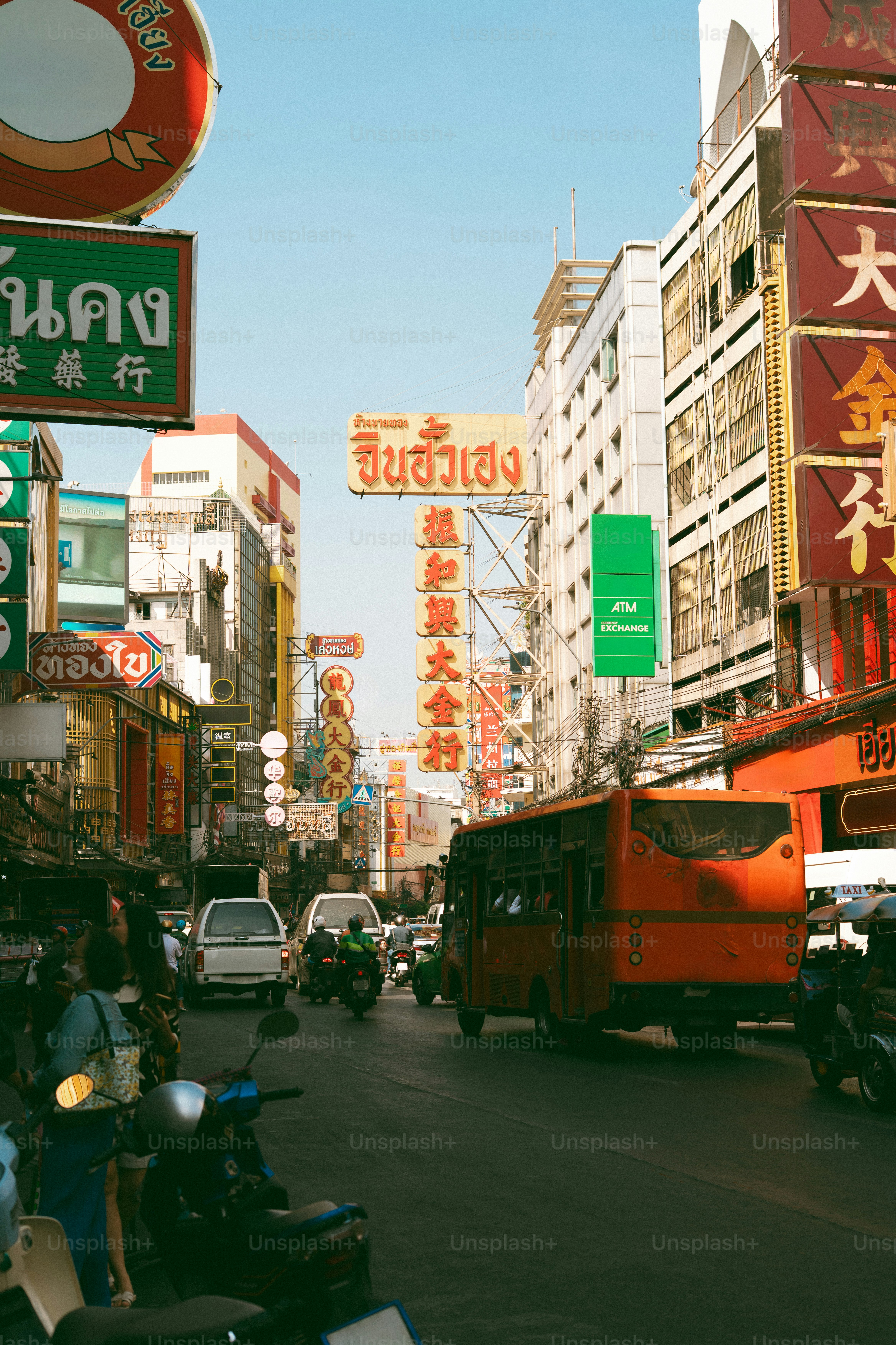 Bustling street in bangkok's chinatown with vibrant signs
