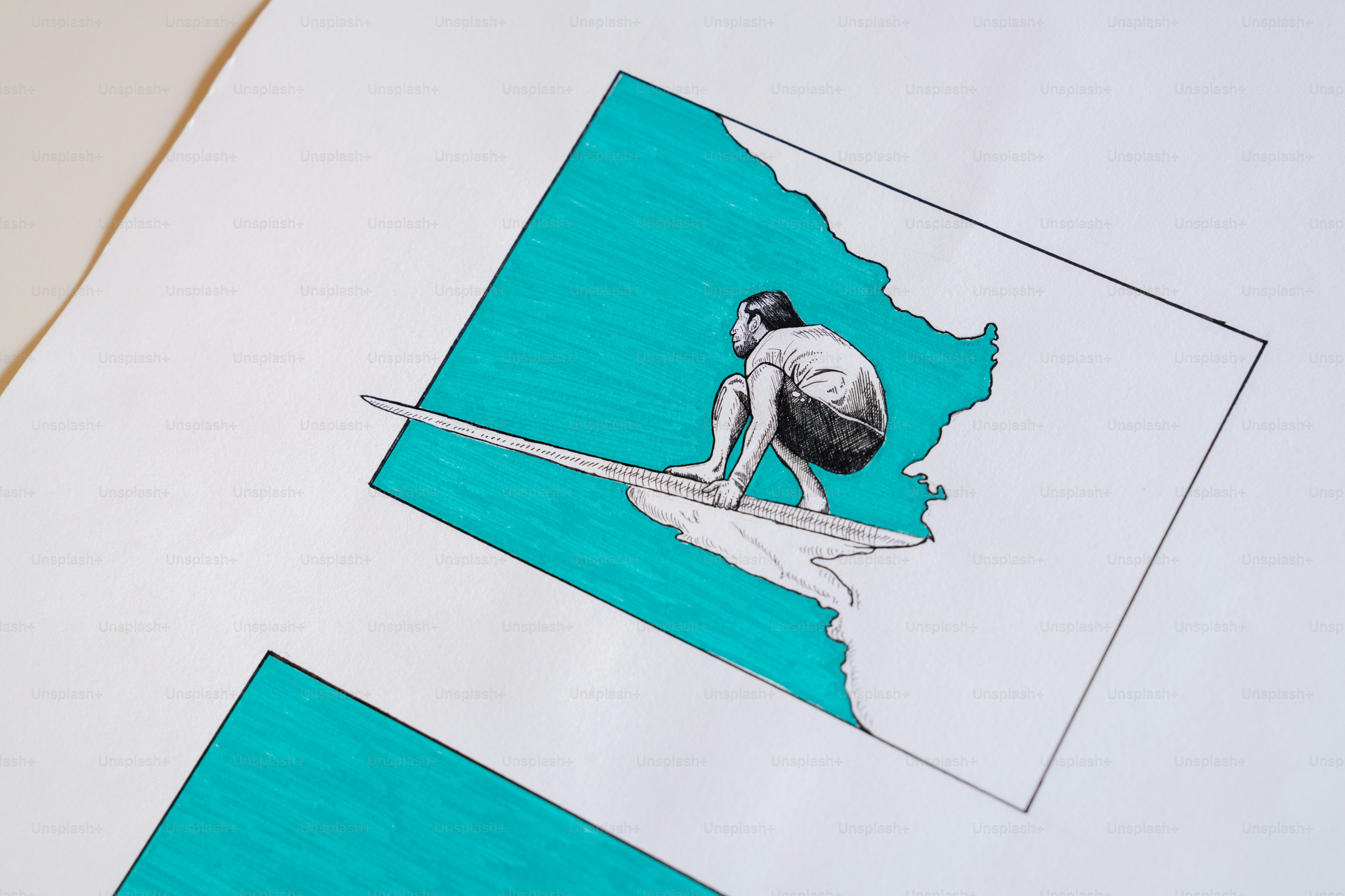 Surfeur dessinant sur papier avec fond turquoise