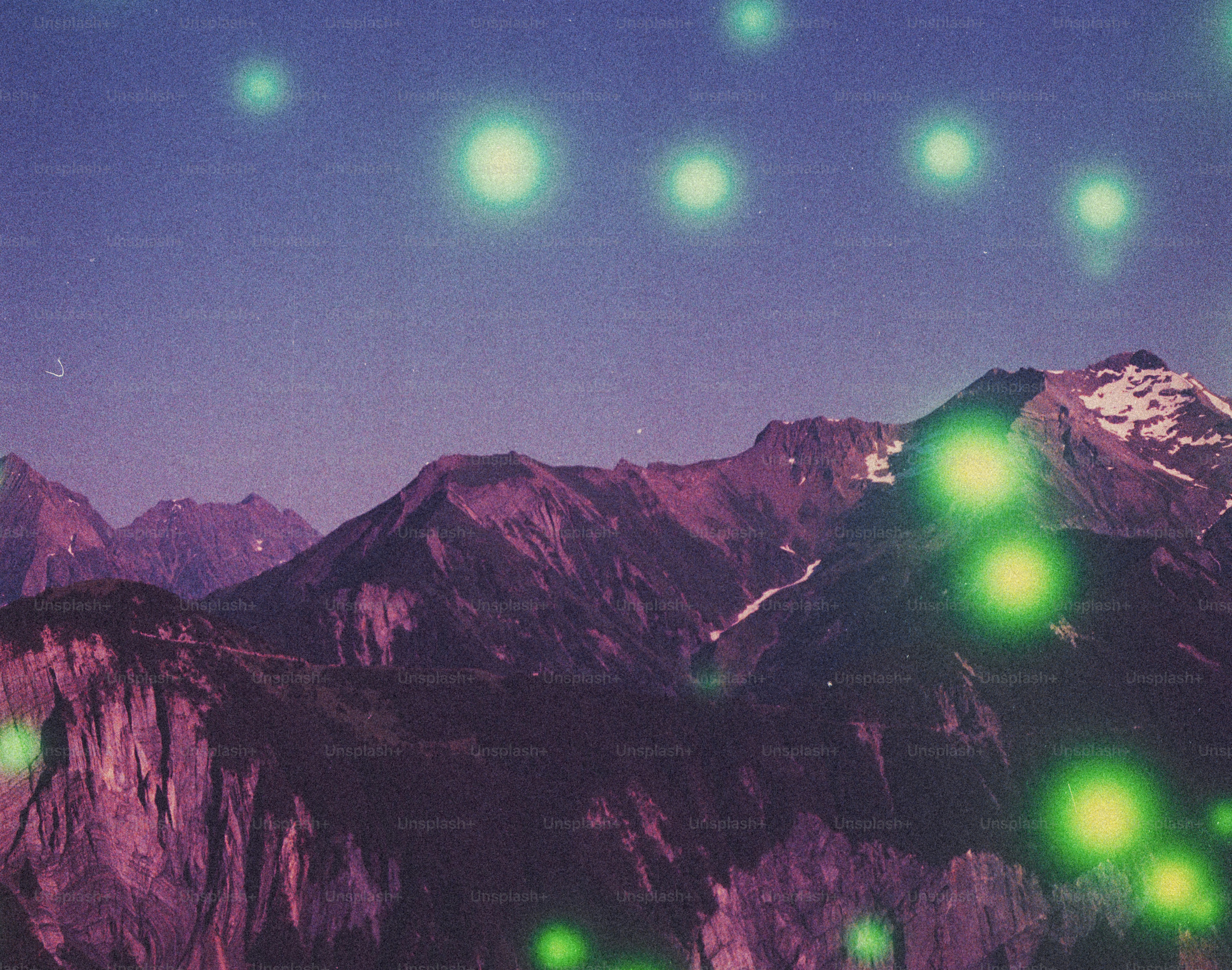 Mysterious green orbs floating above purple mountains