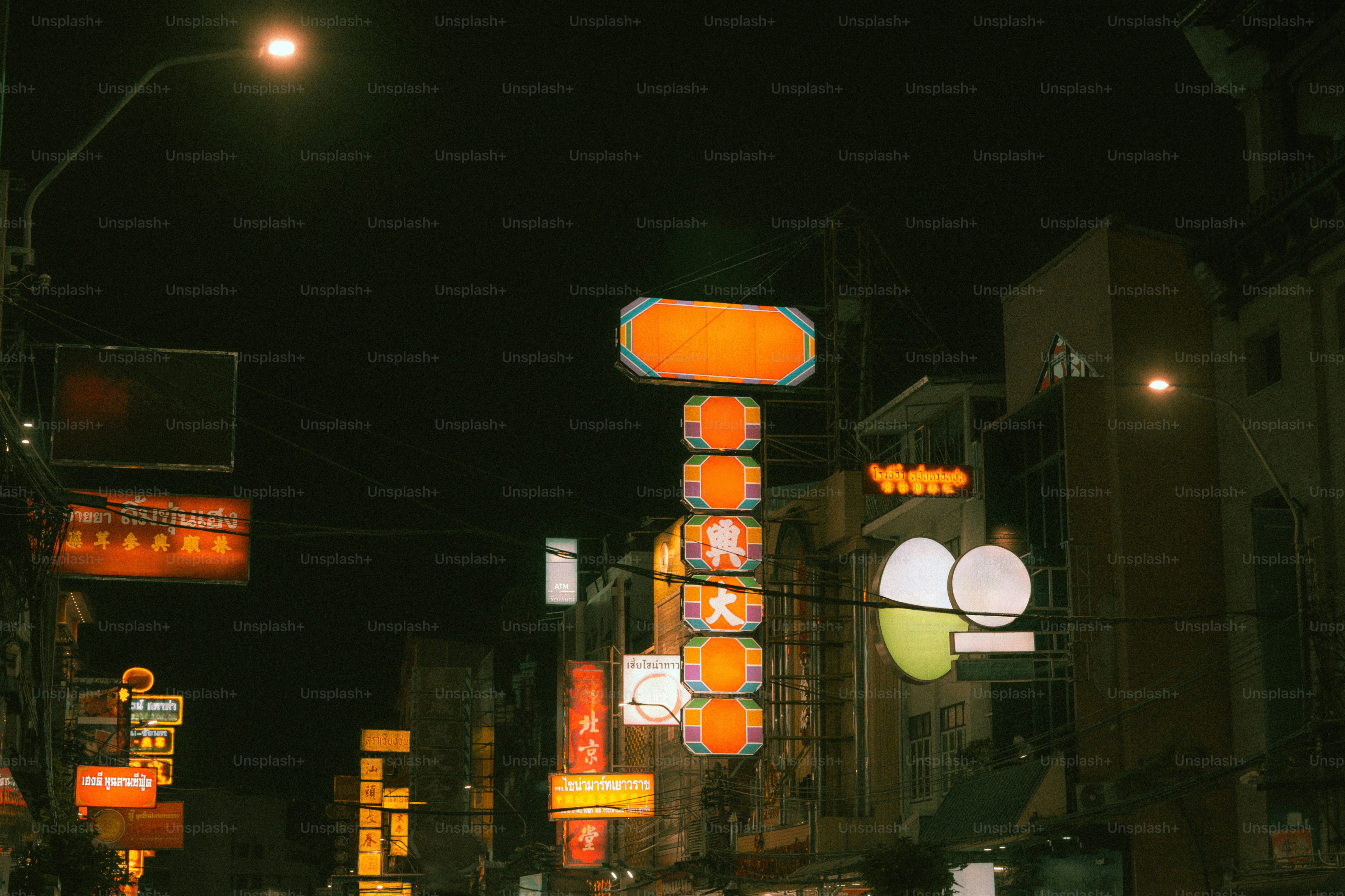 Illuminated neon signs in Chinatown at night in Bangkok, Thailand.