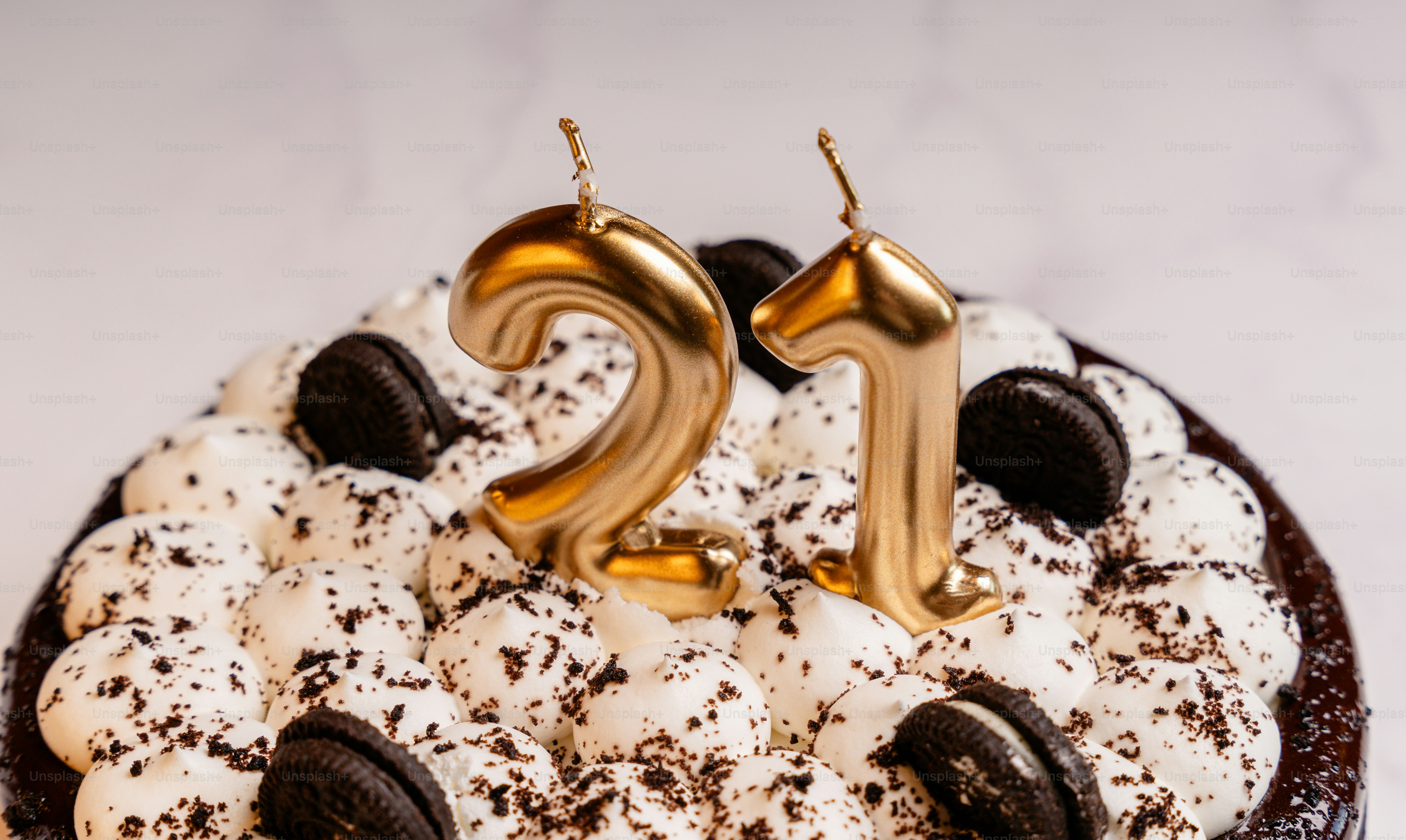 Birthday cake with golden twenty-one candles