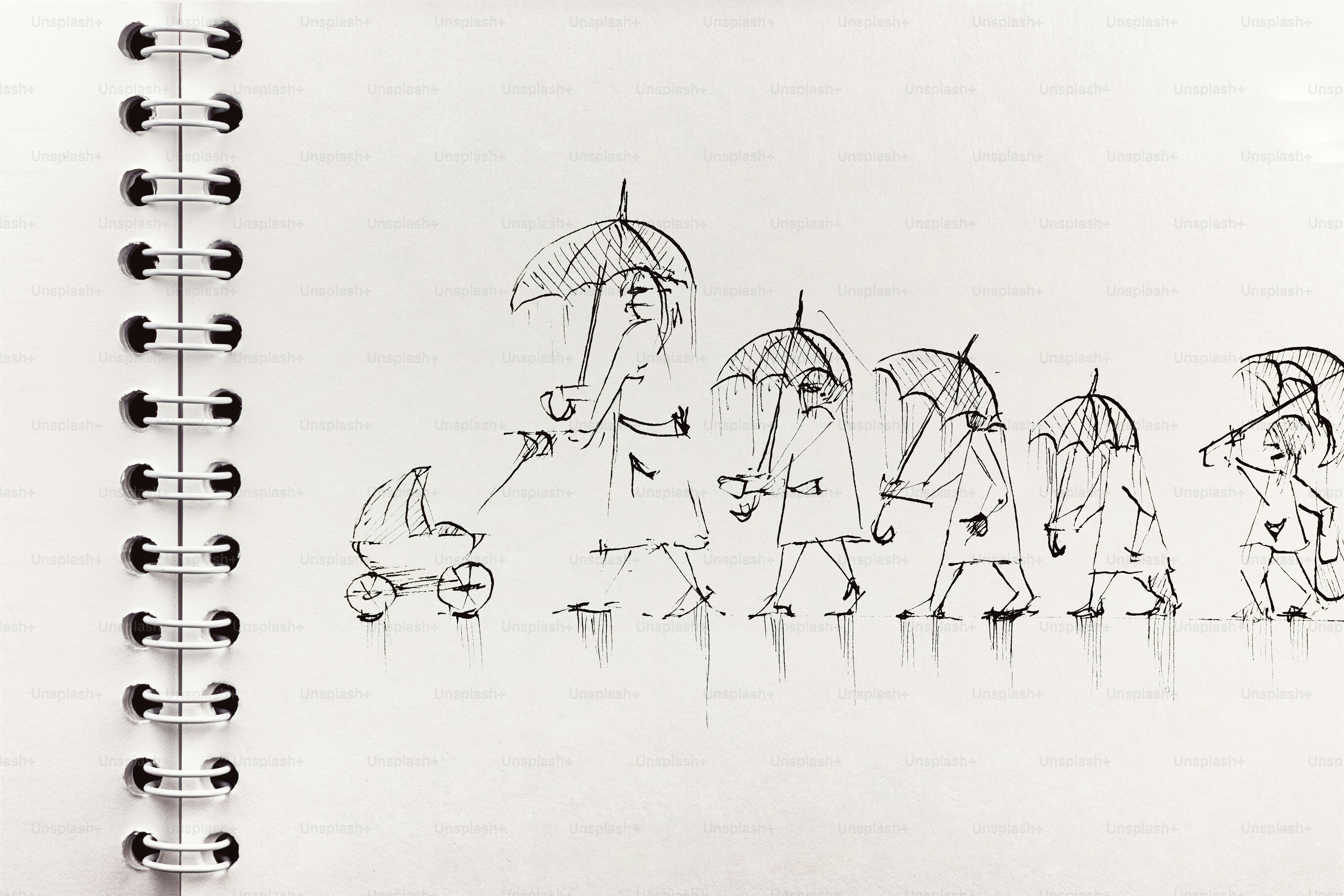 雨の中で傘を持った家族の歩き方のスケッチ