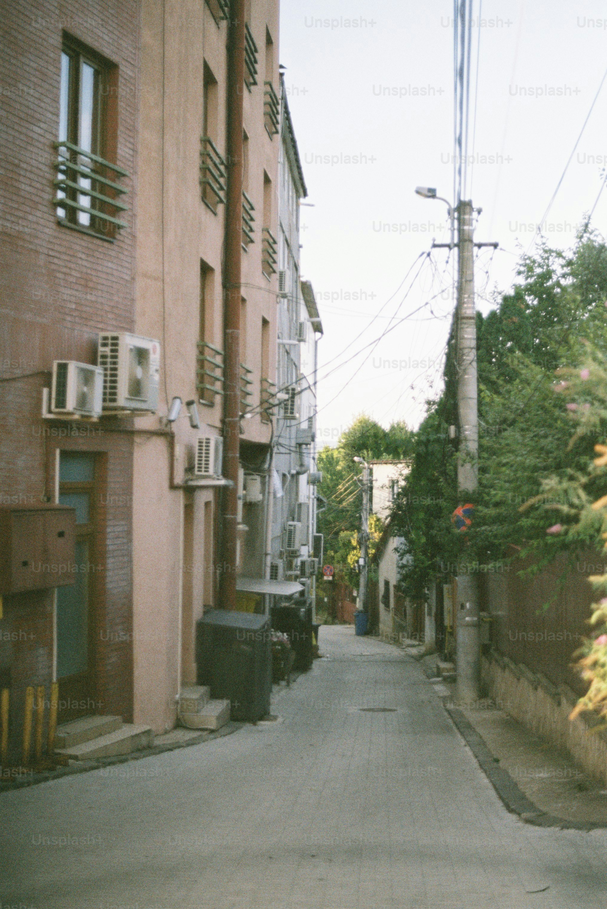 Quiet alley between buildings with air conditioners