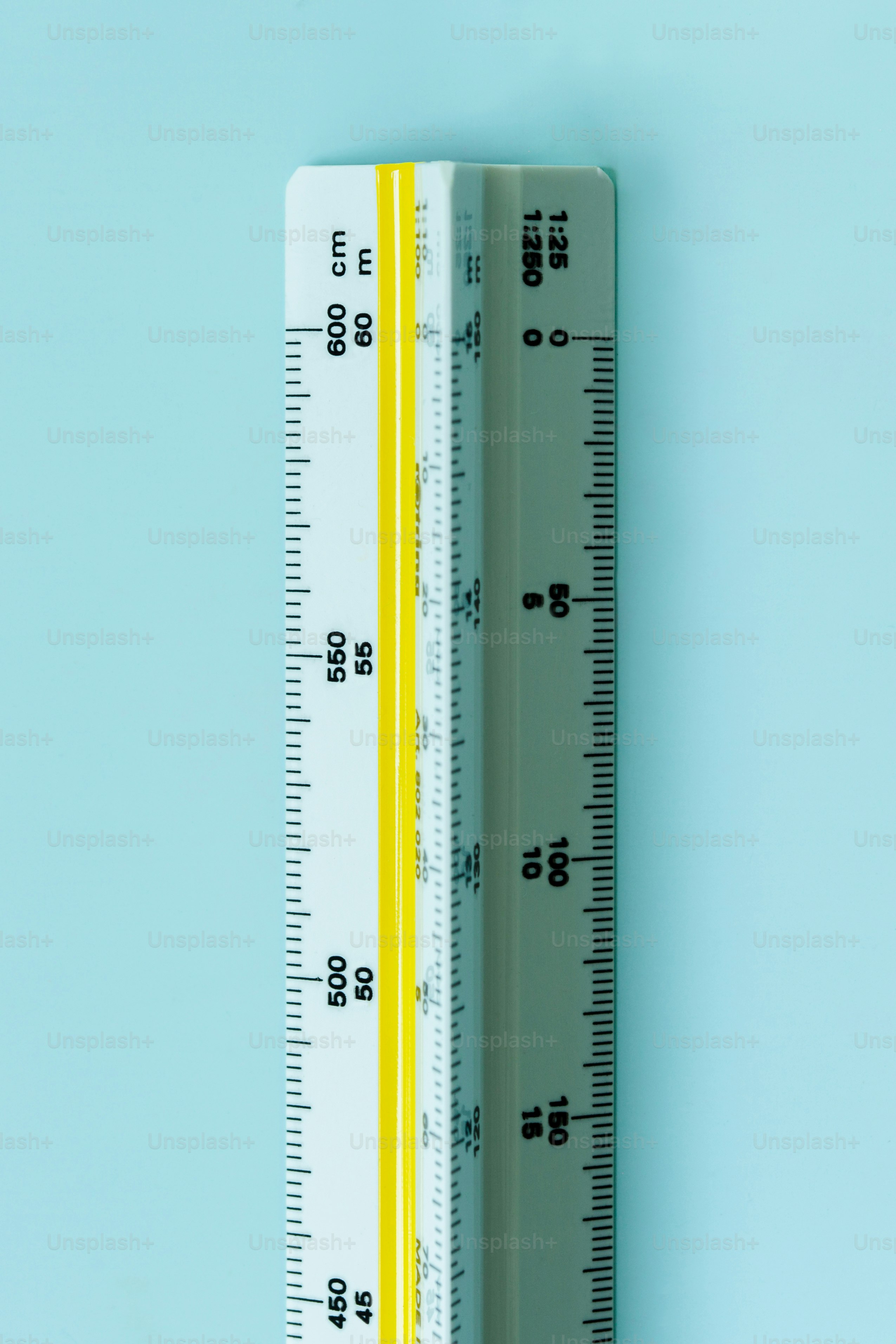 Architectural scale ruler with yellow stripe on blue