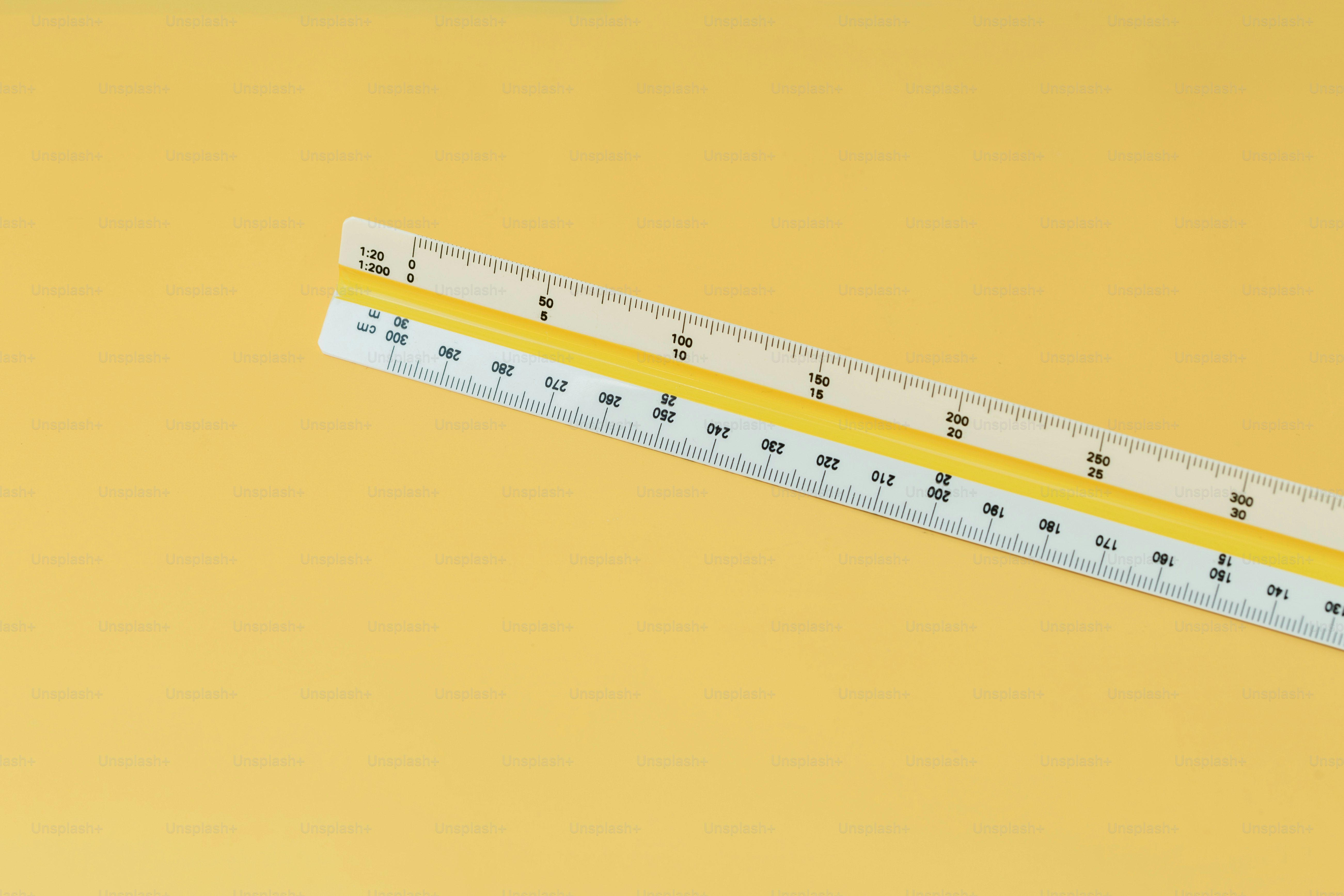 Scale ruler with yellow stripe on yellow background