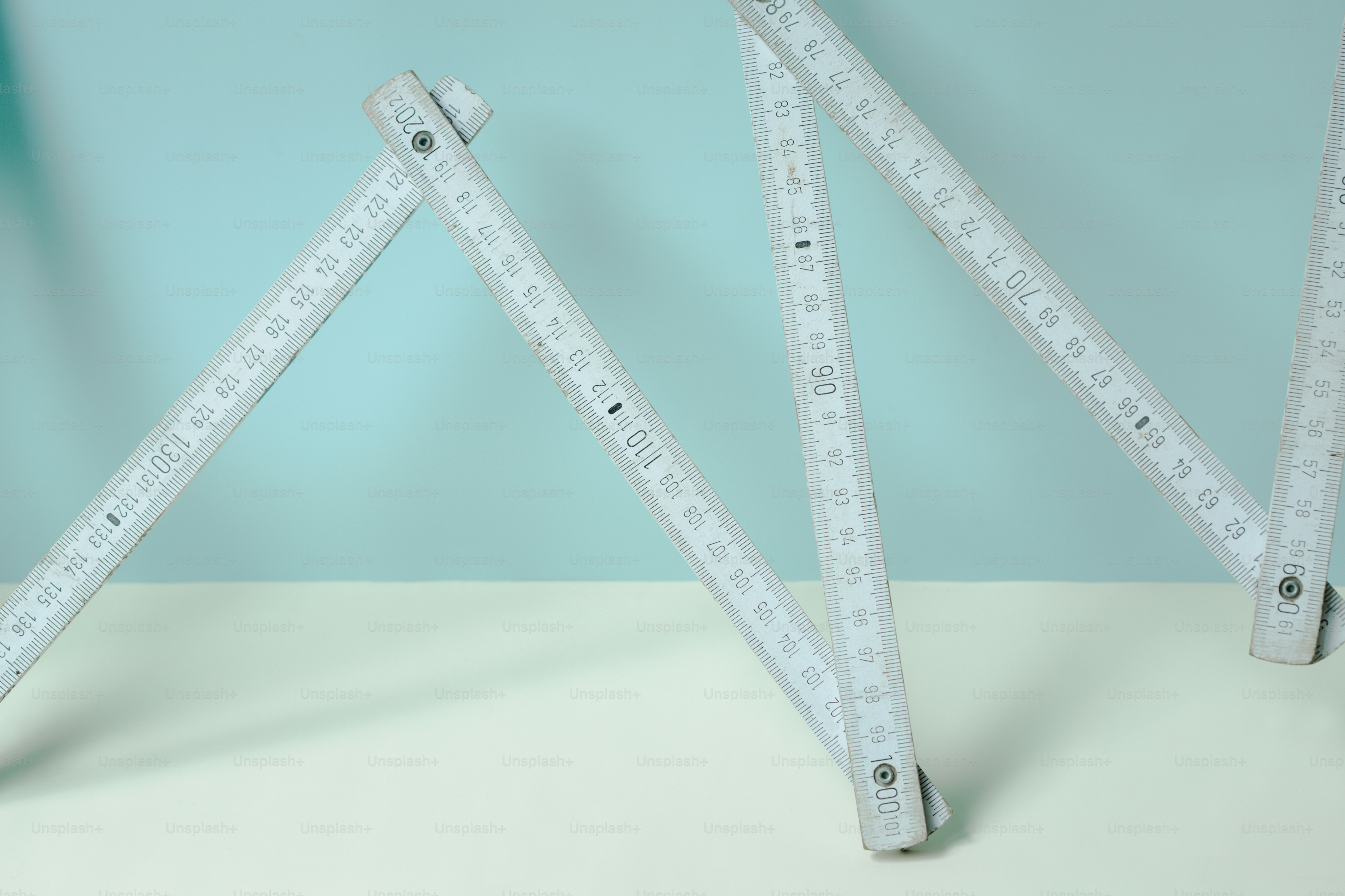 White folding ruler on blue background