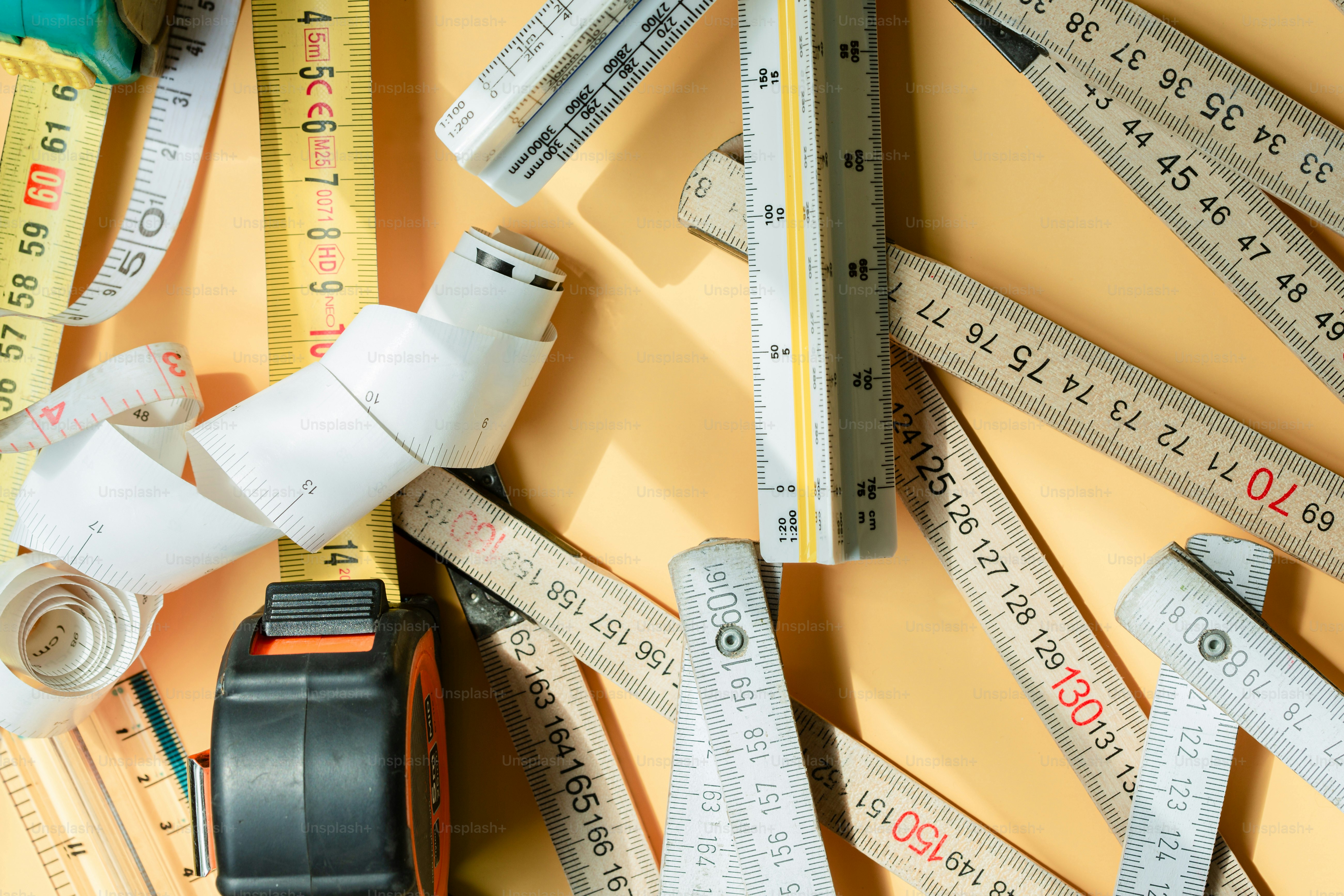Various measuring tools scattered on a yellow background