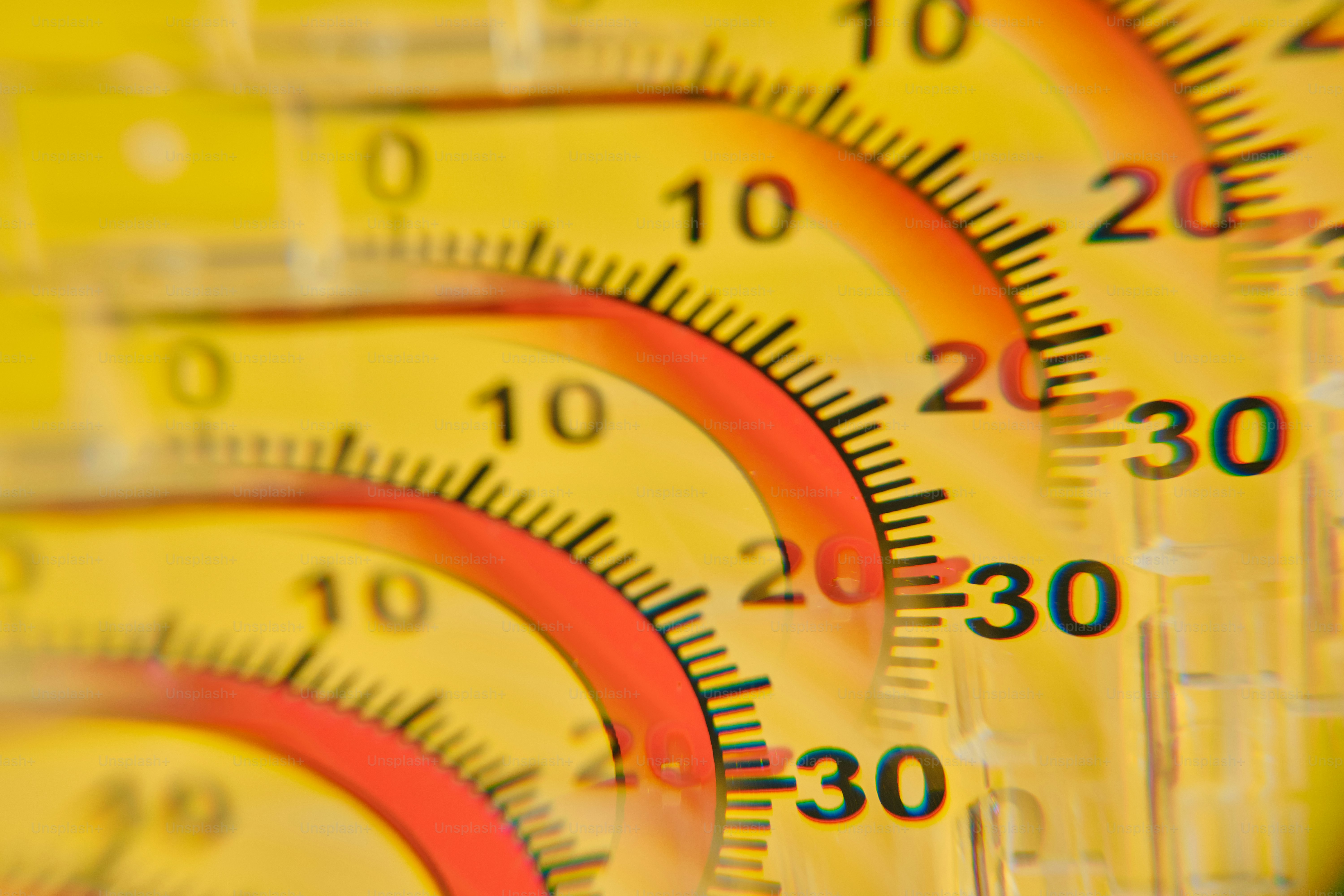 Yellow and red measuring instruments with curved scales