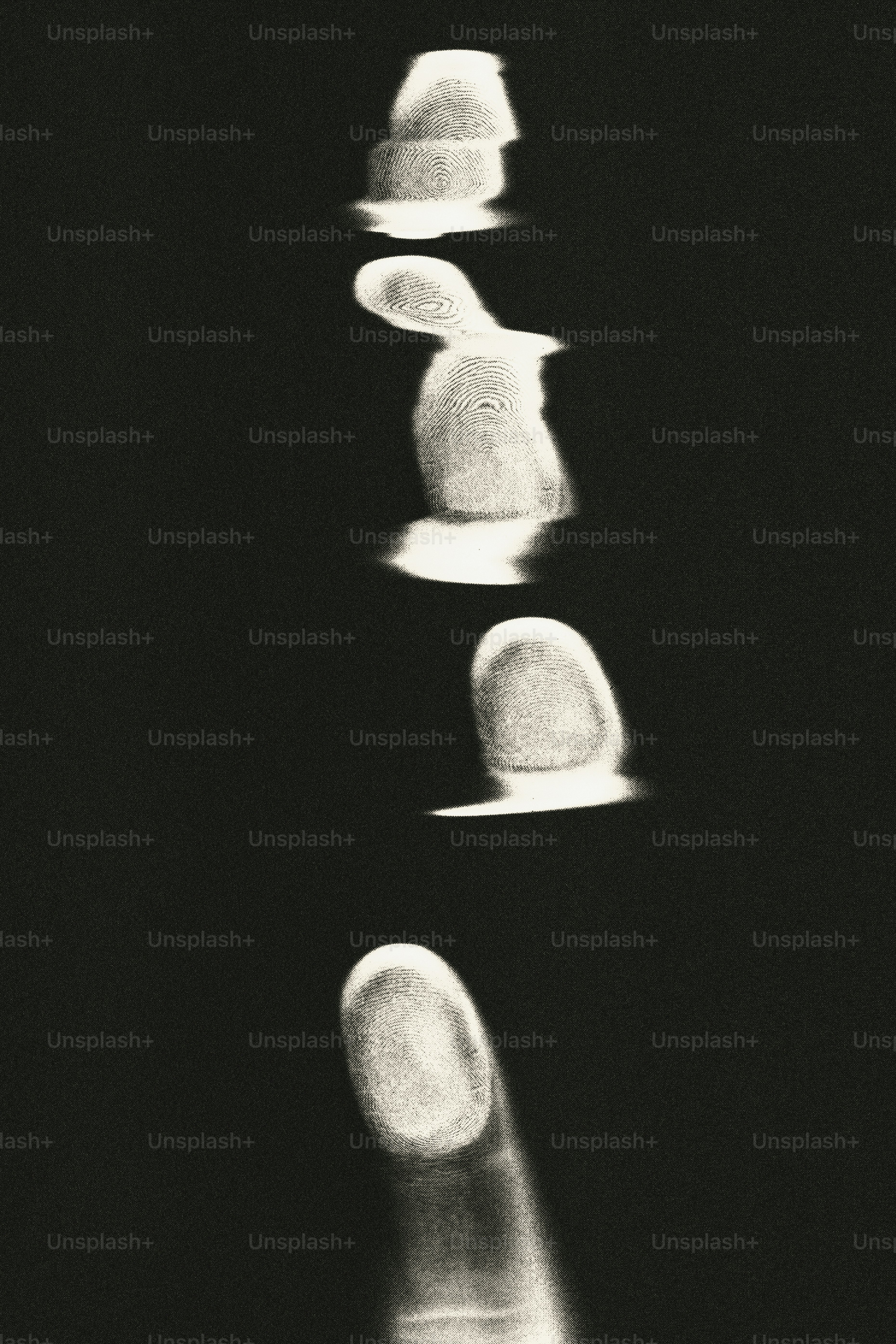 Vertical sequence of blurry, abstract finger impressions