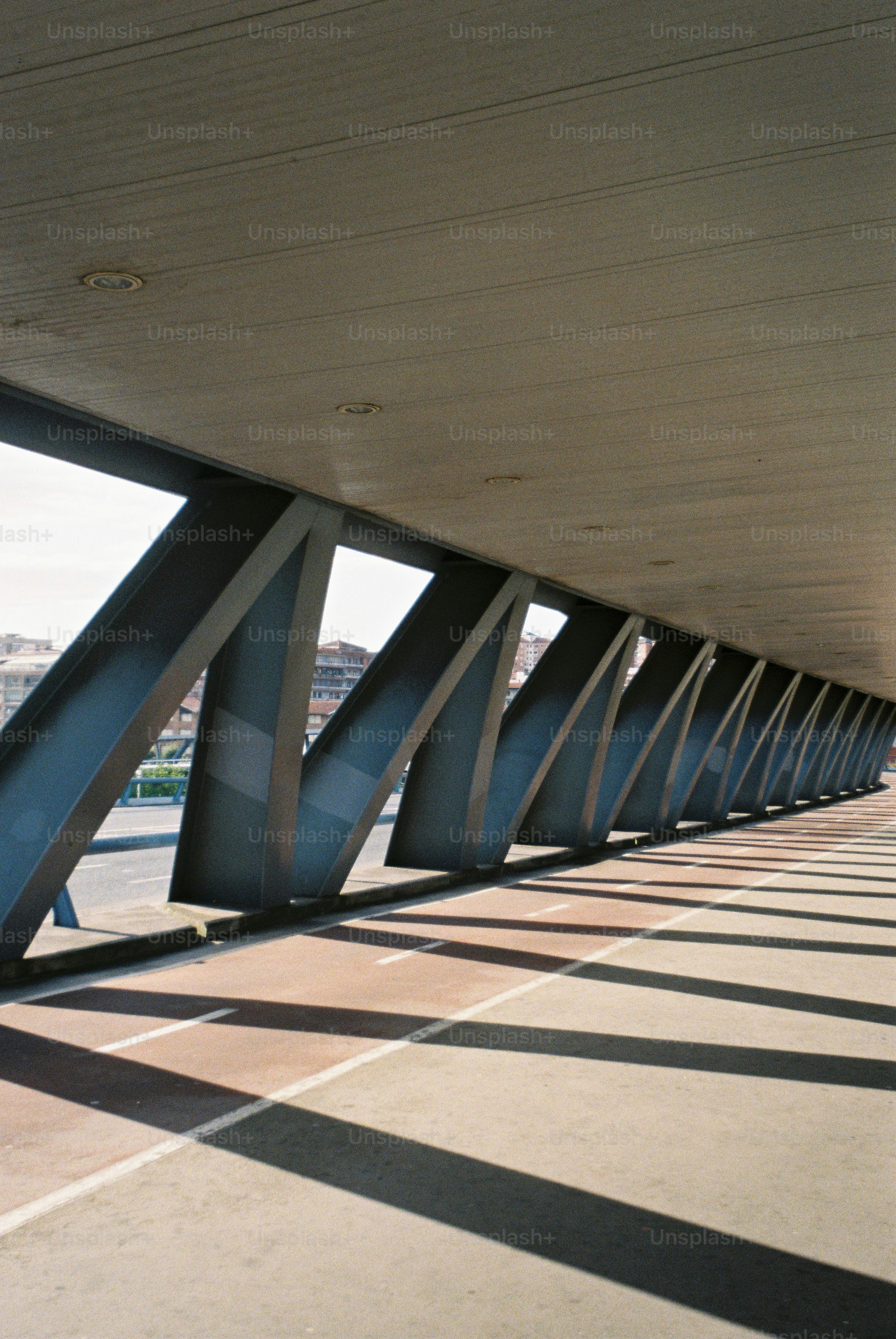 Architectural walkway casting strong geometric shadows