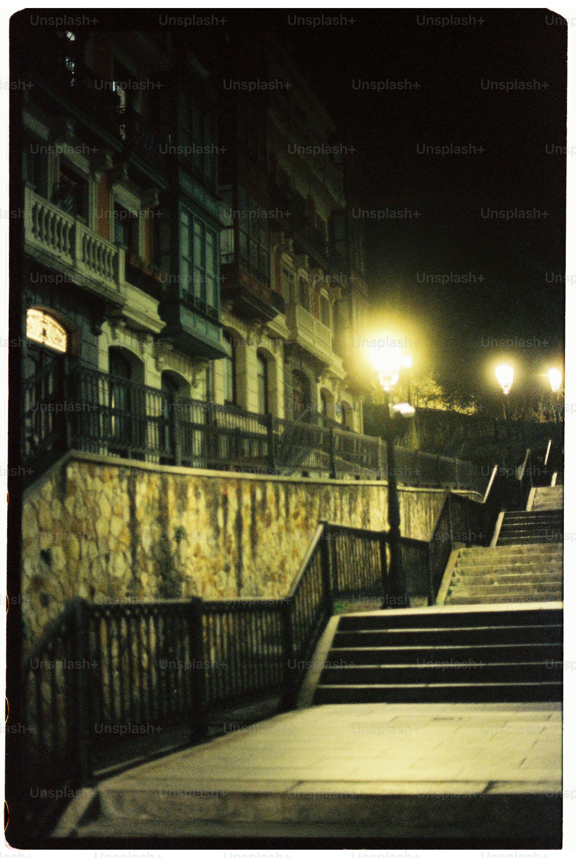 Long staircase illuminated by streetlamp at night
