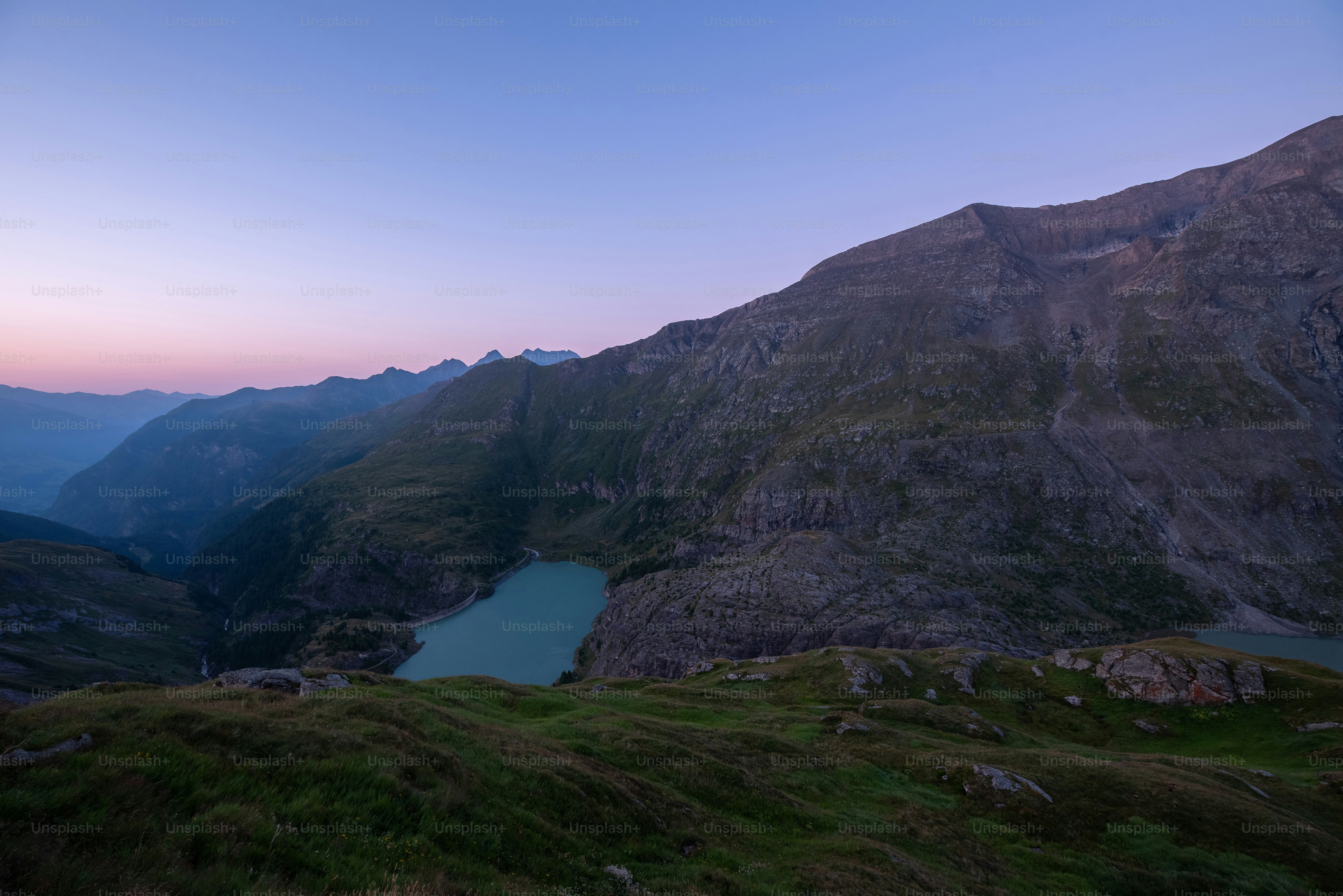 Margaritzenstausee lake nestled among rocky mountain peaks in the Hohe Tauern, Austria