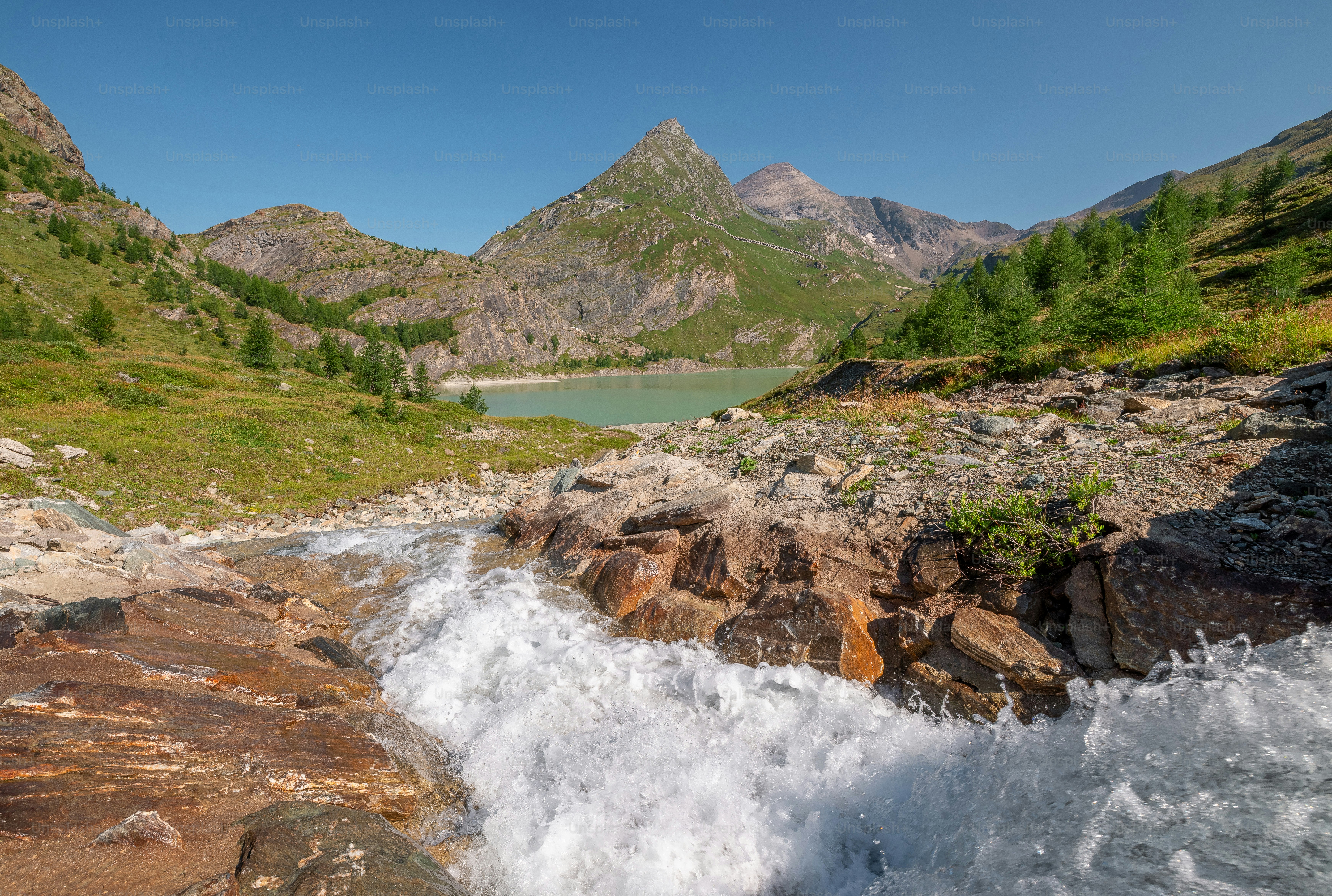 A rushing stream flowing into Margaritzenstausee lake in the Hohe Tauern mountains of Austria
