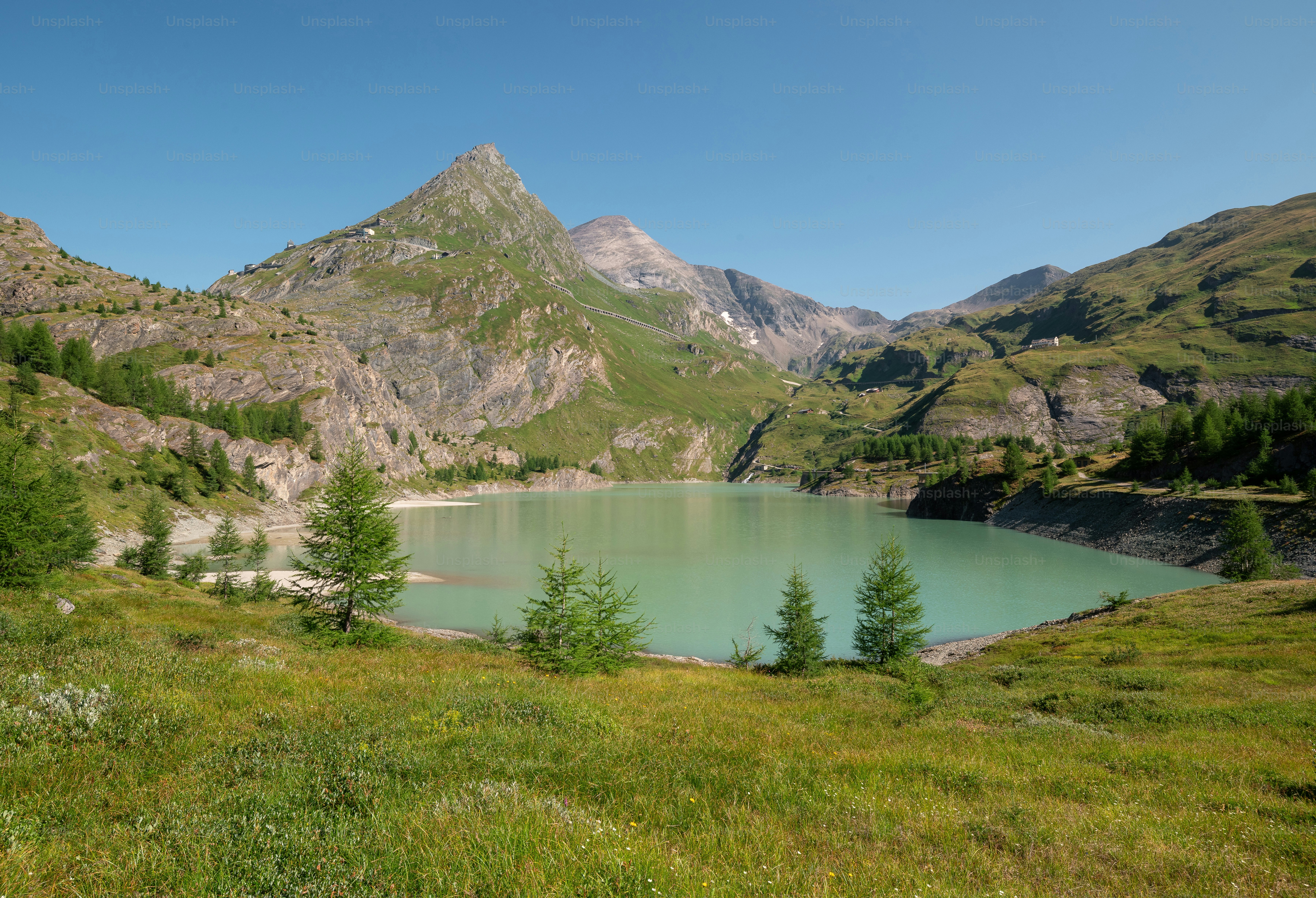 The Margaritzenstausee lake surrounded by green mountains in the Hohe Tauern National Park, Austria