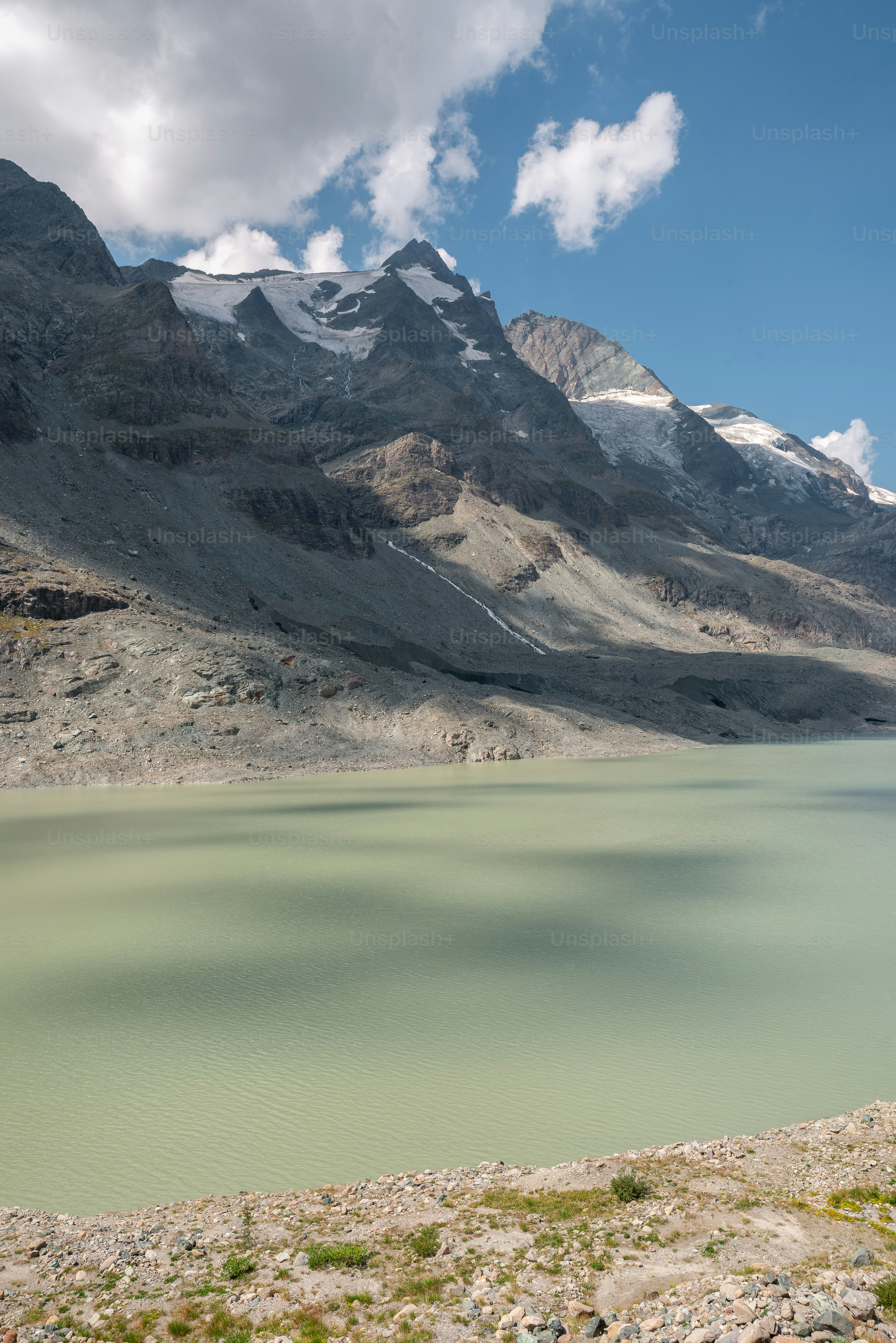 Sandersee Lake below the Pasterze glacier and Grossglockner peak in the Austrian Alps