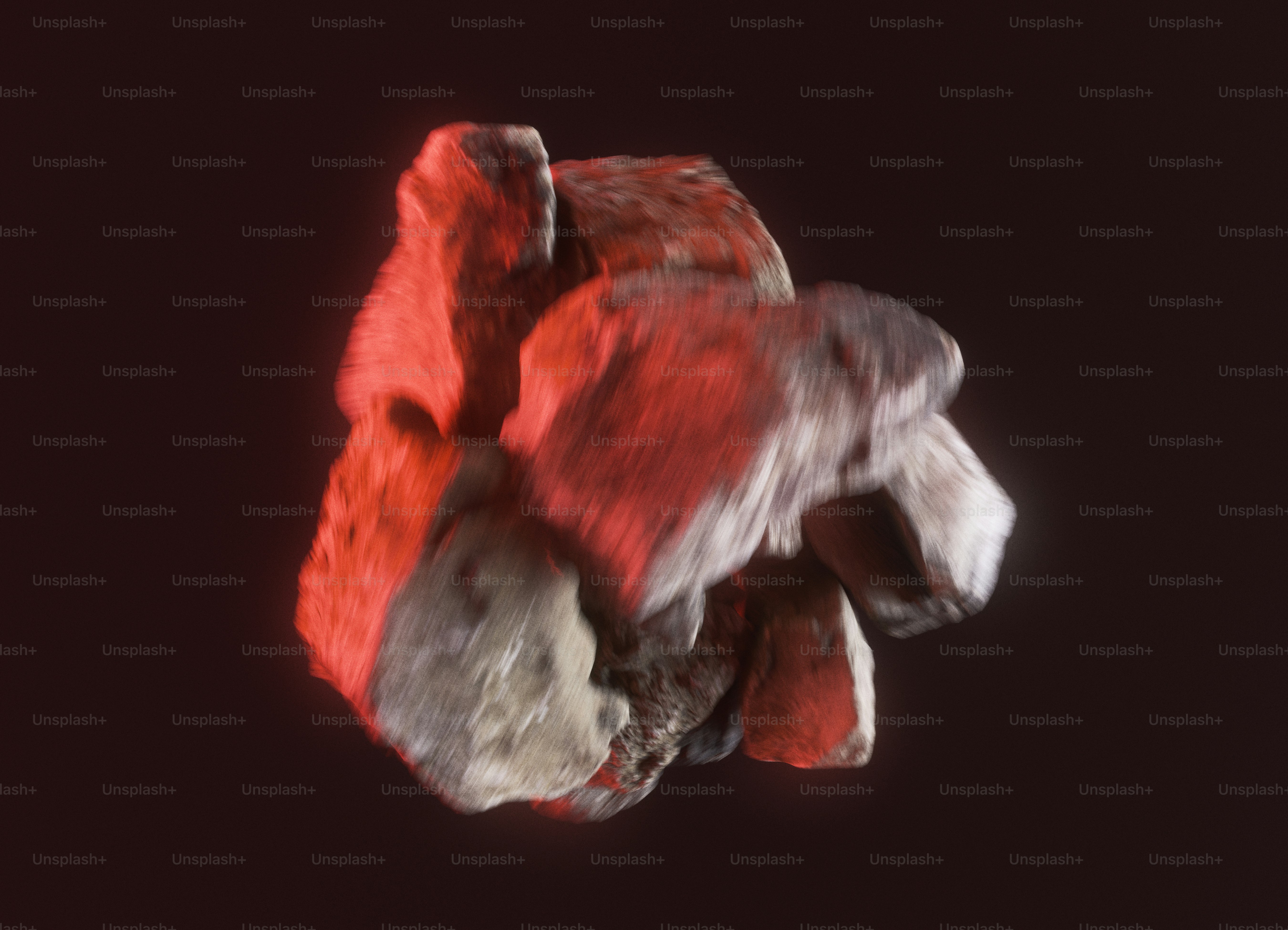 A cluster of glowing red and grey rocks against a dark background