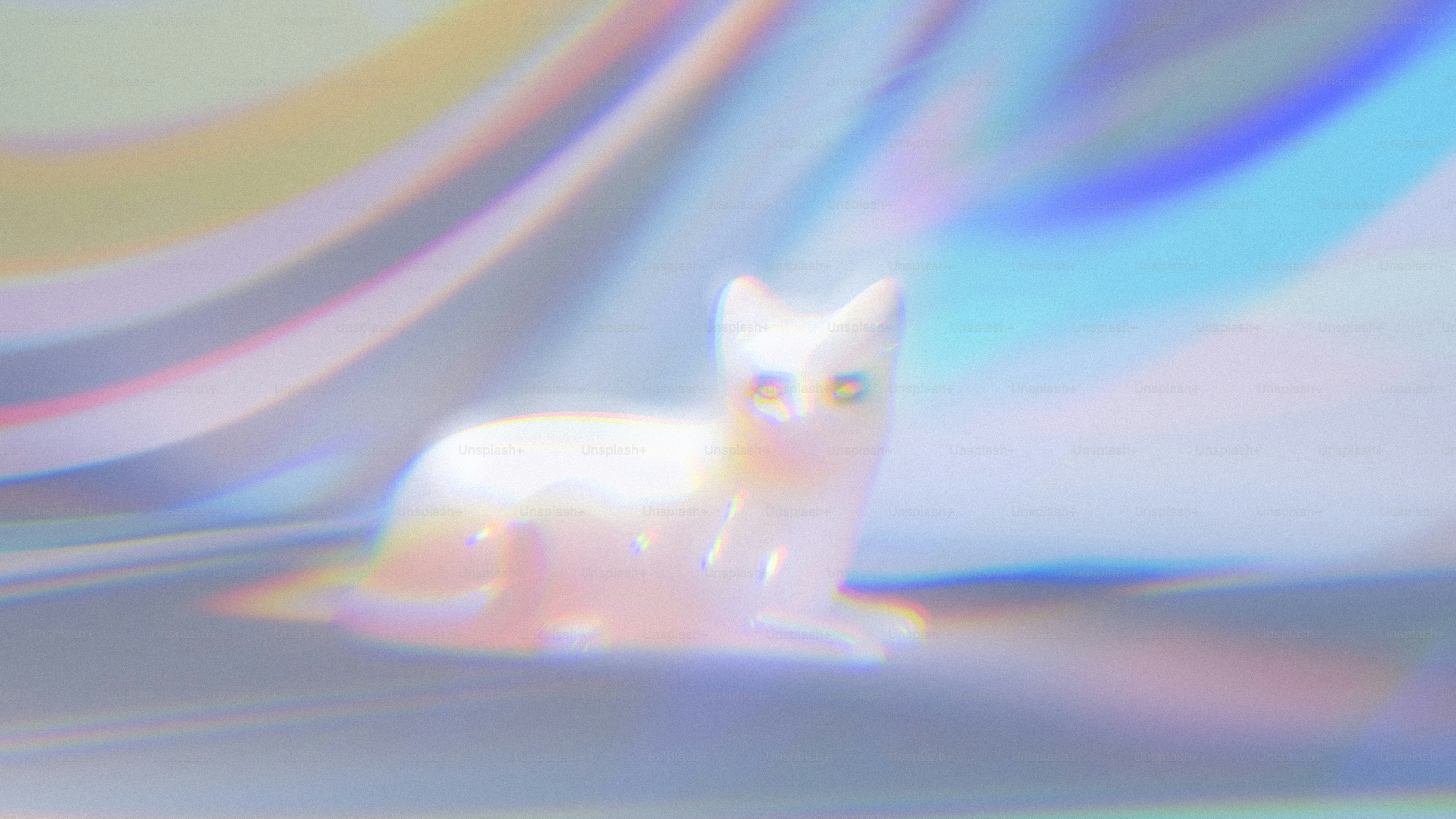 A small white cat figurine surrounded by soft iridescent light refractions