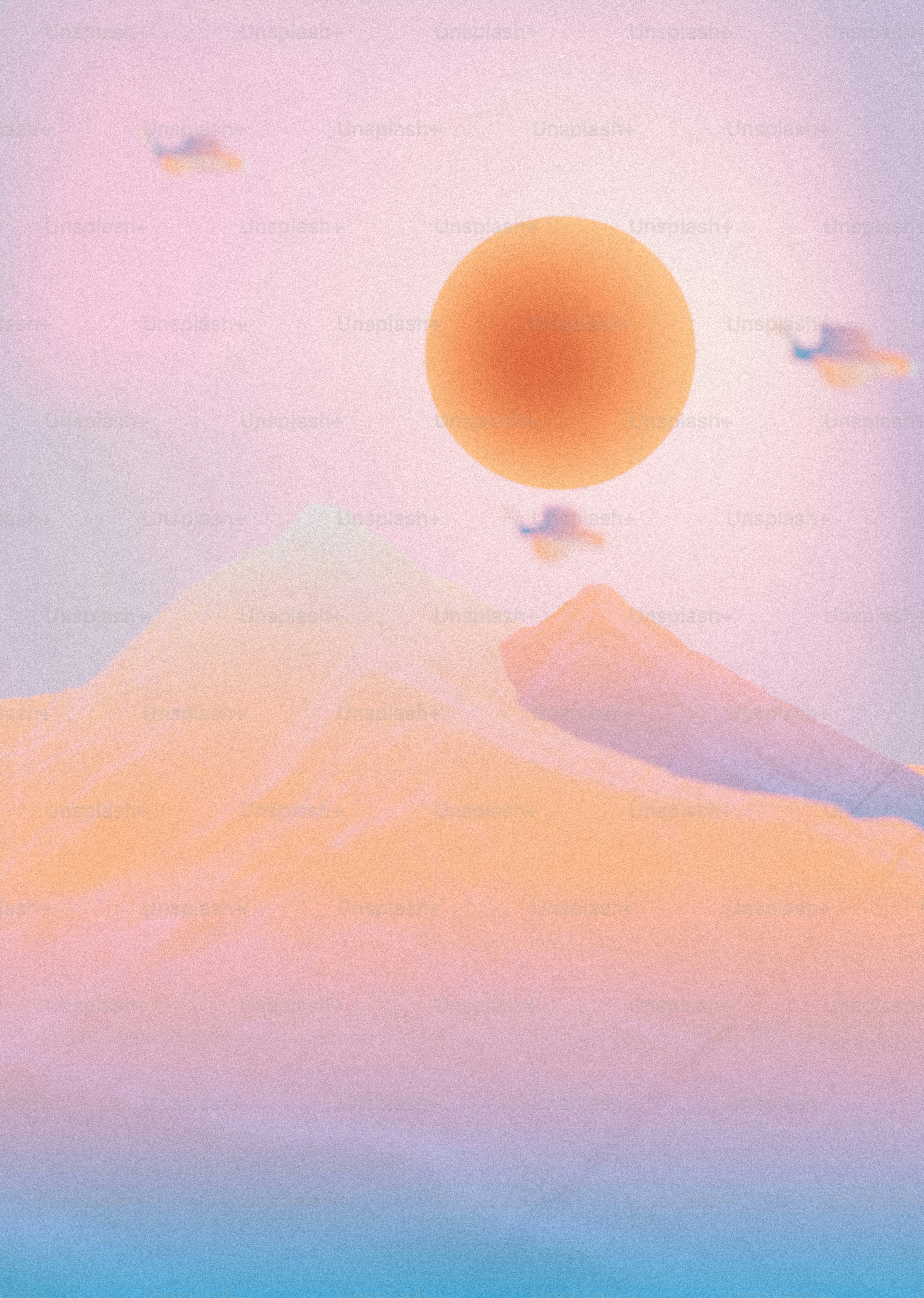 A glowing orange orb above soft, pastel-colored mountain peaks in a hazy sky
