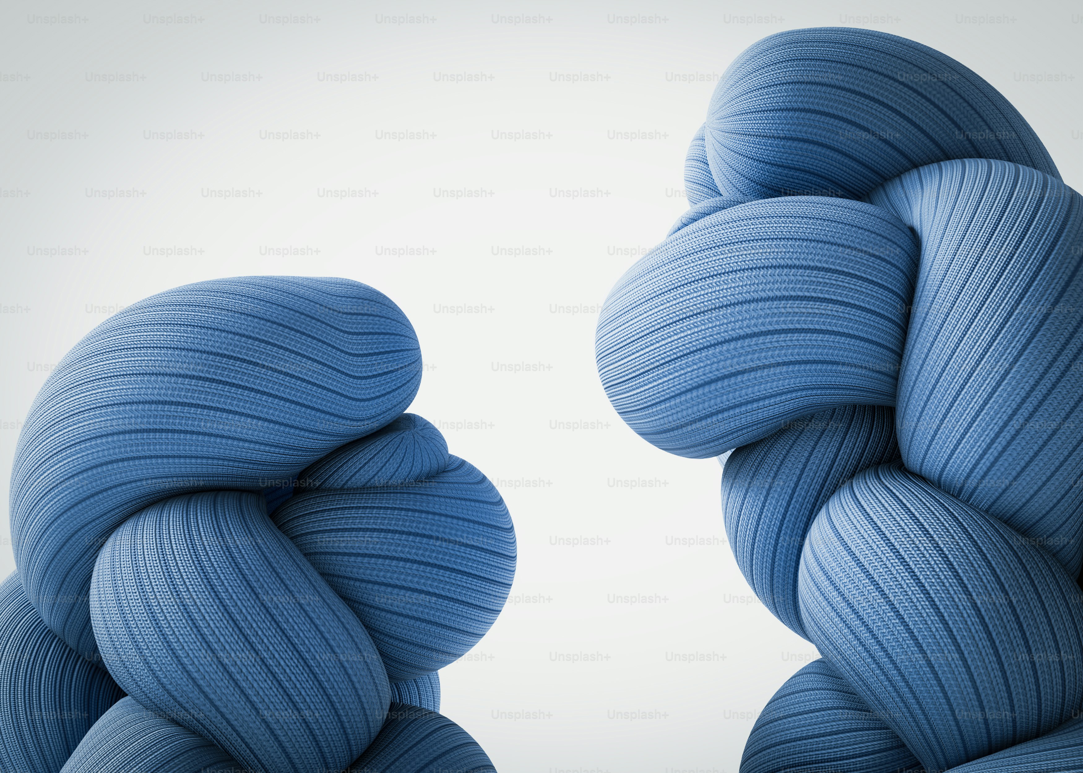 Two thick blue braided fabric ropes against a plain white background
