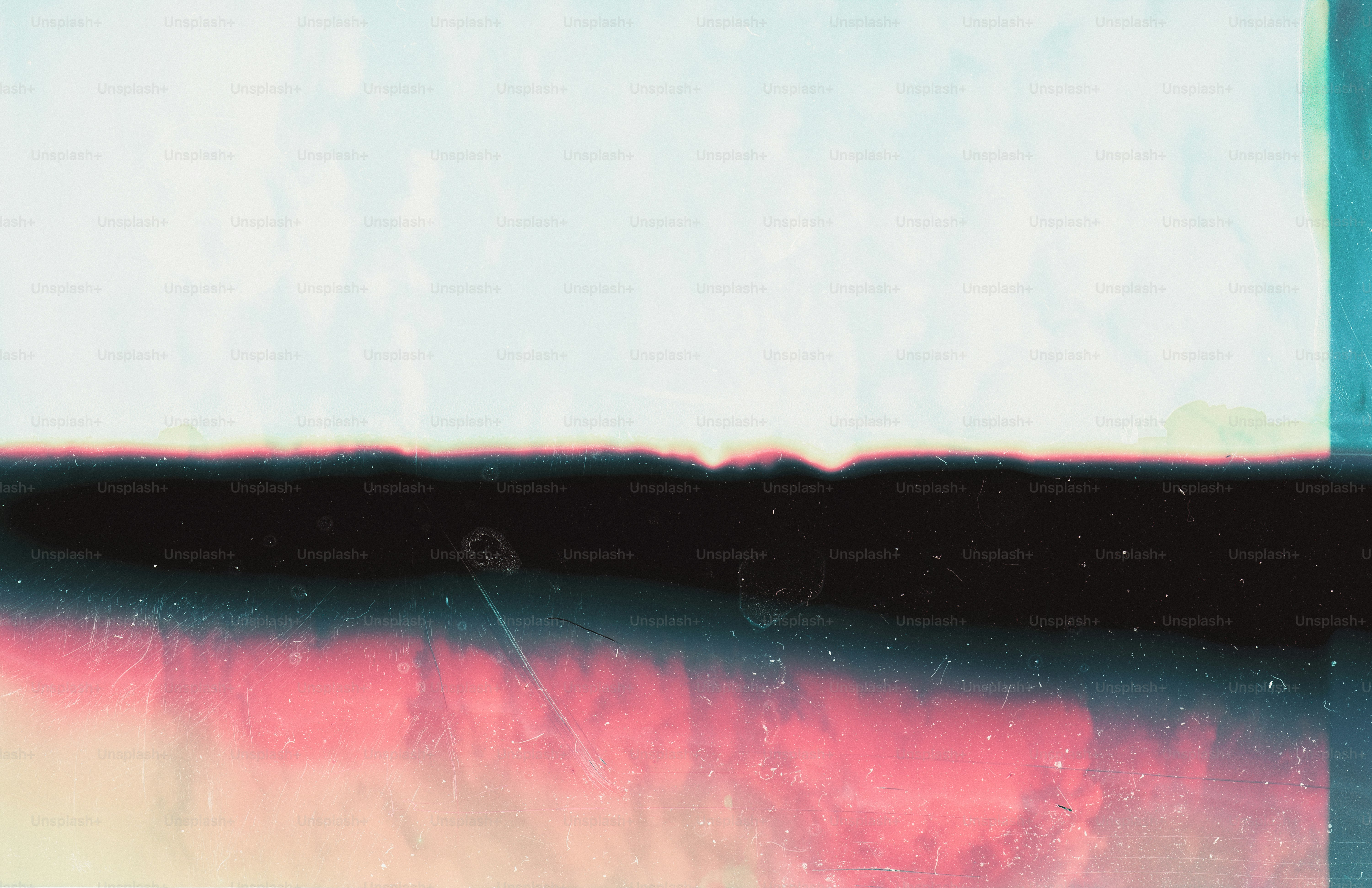 A horizontal abstract composition with light blue, black, and pink textured layers.