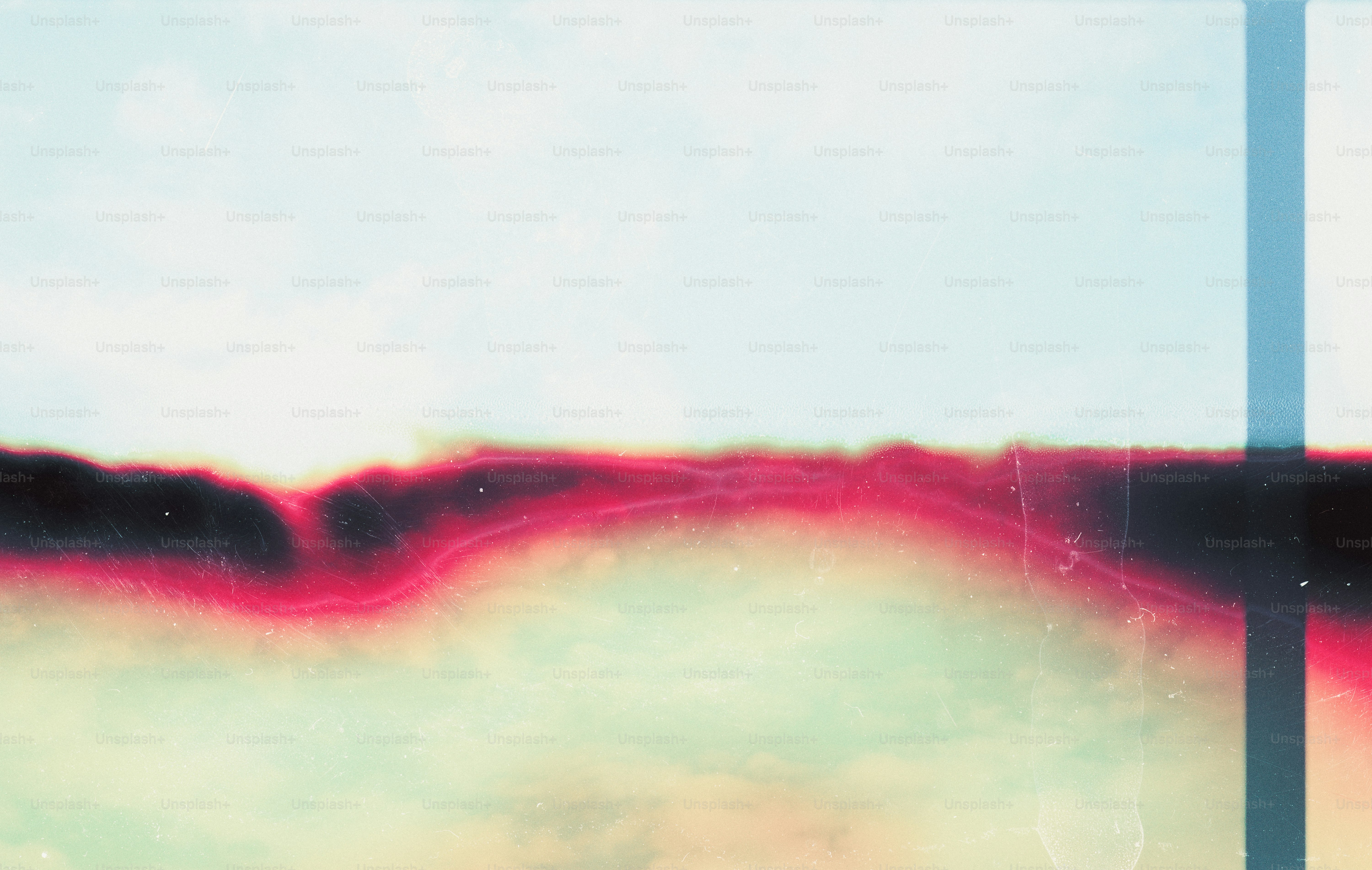 A horizontal band of vibrant pink and black light leak on a pale background.