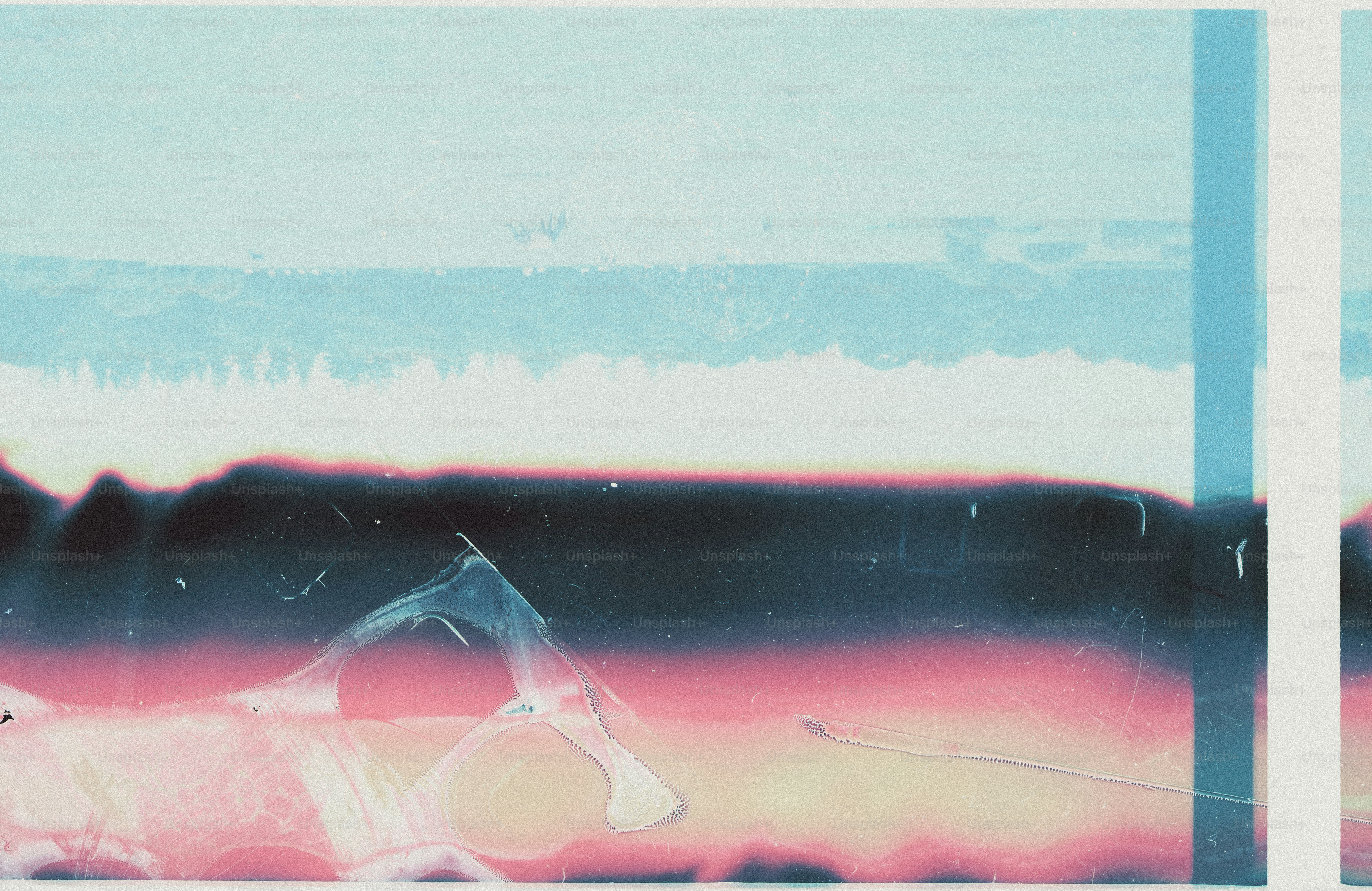 Abstract film grain texture with horizontal bands of blue, black, and pink light leaks.