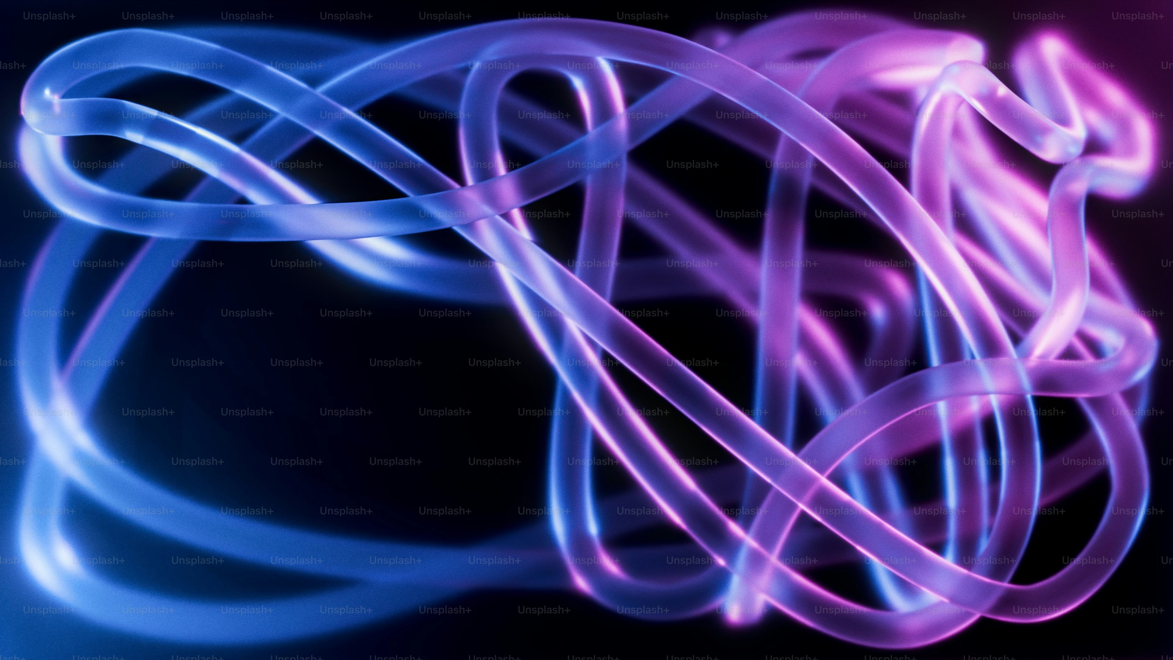Glowing blue and purple light trails forming an abstract tangled pattern