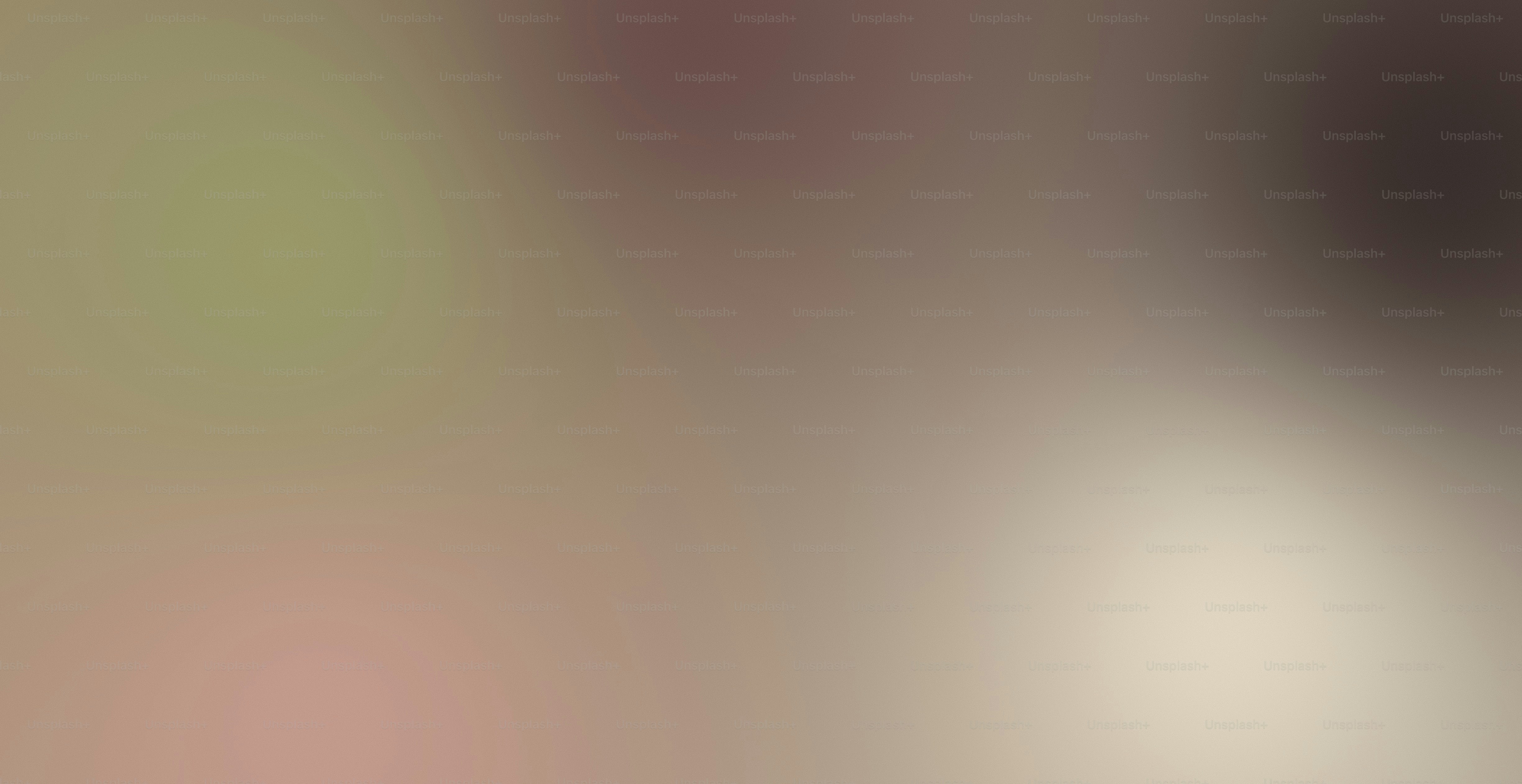 A soft, out-of-focus gradient shifting from muted olive to warm beige.