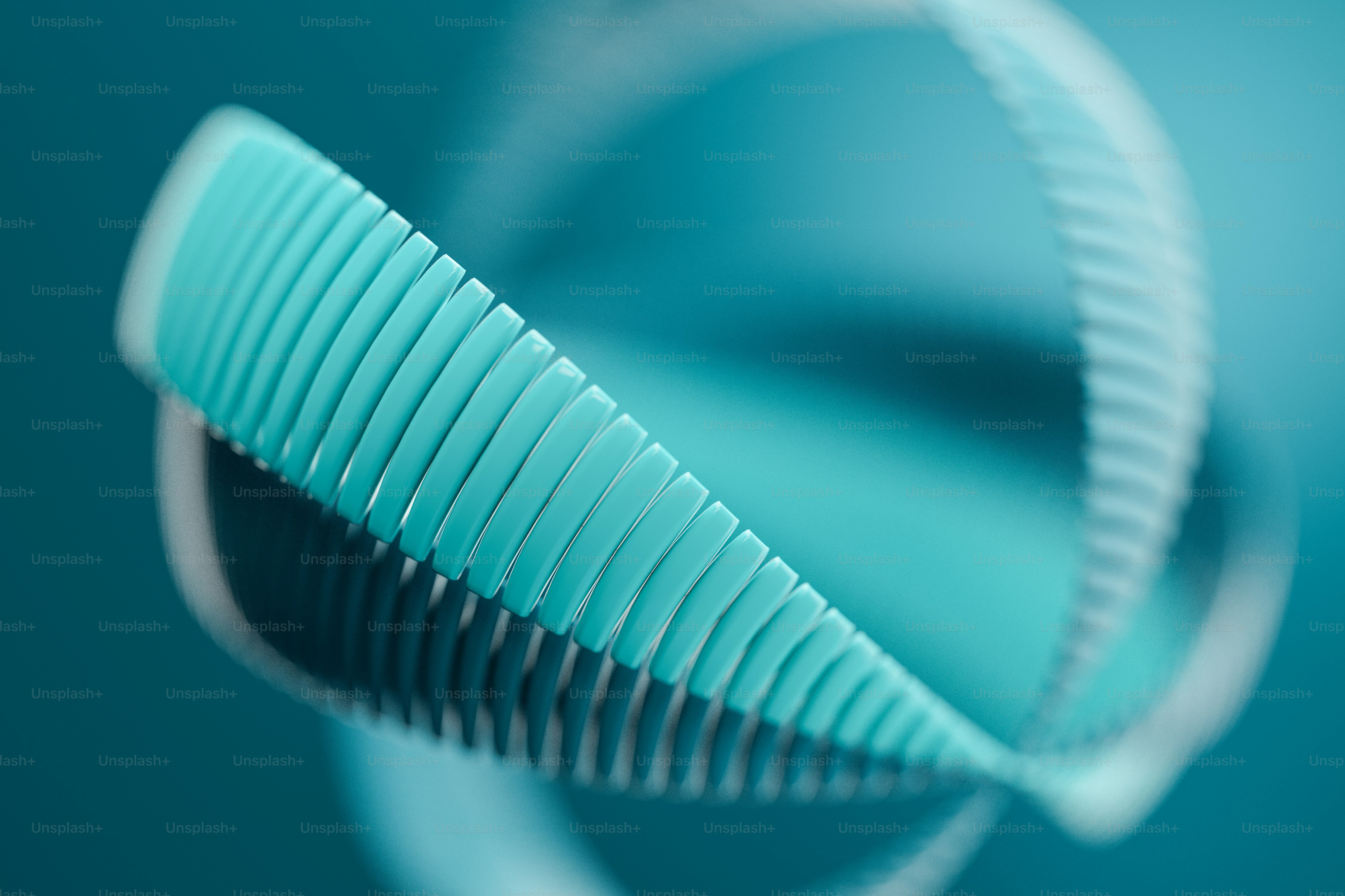 A teal spiral structure with repeating segments against a matching teal background