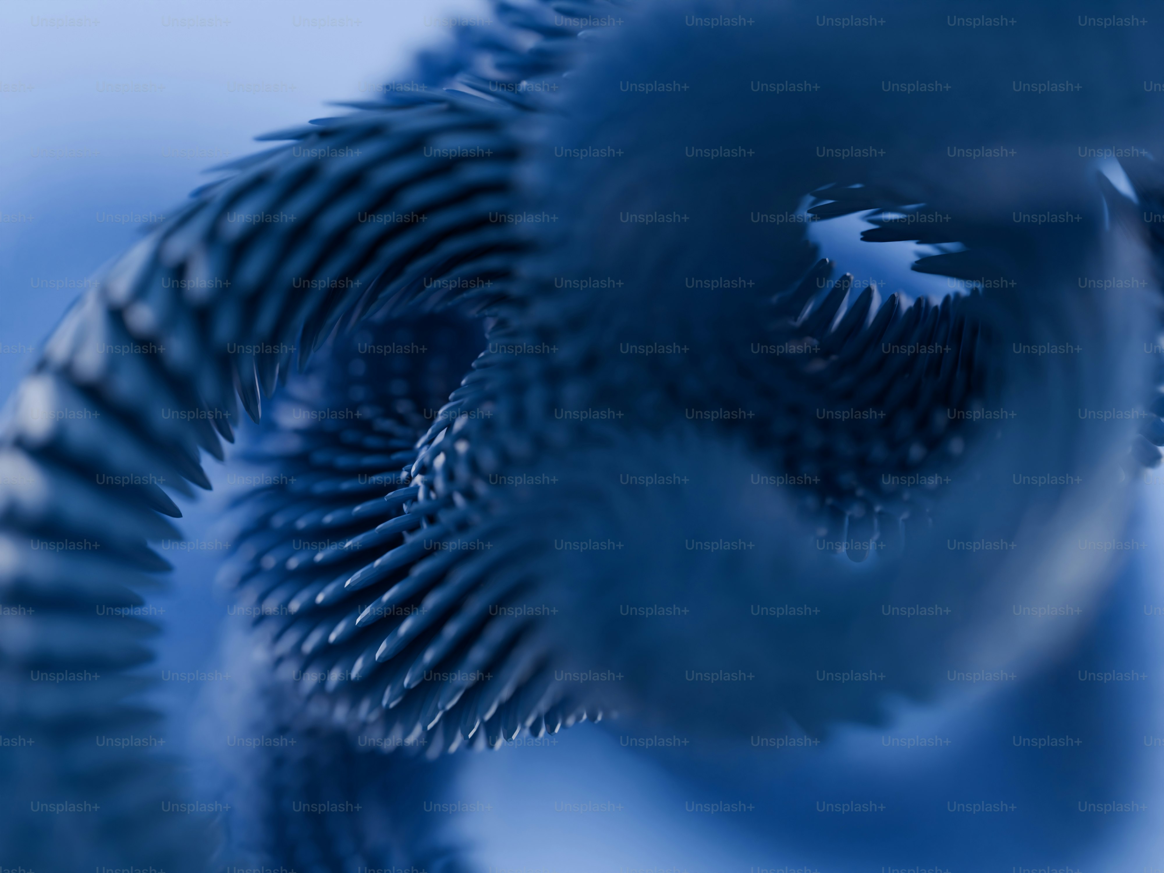 Eine Makroansicht einer blauen, stacheligen, aufgerollten abstrakten Struktur
