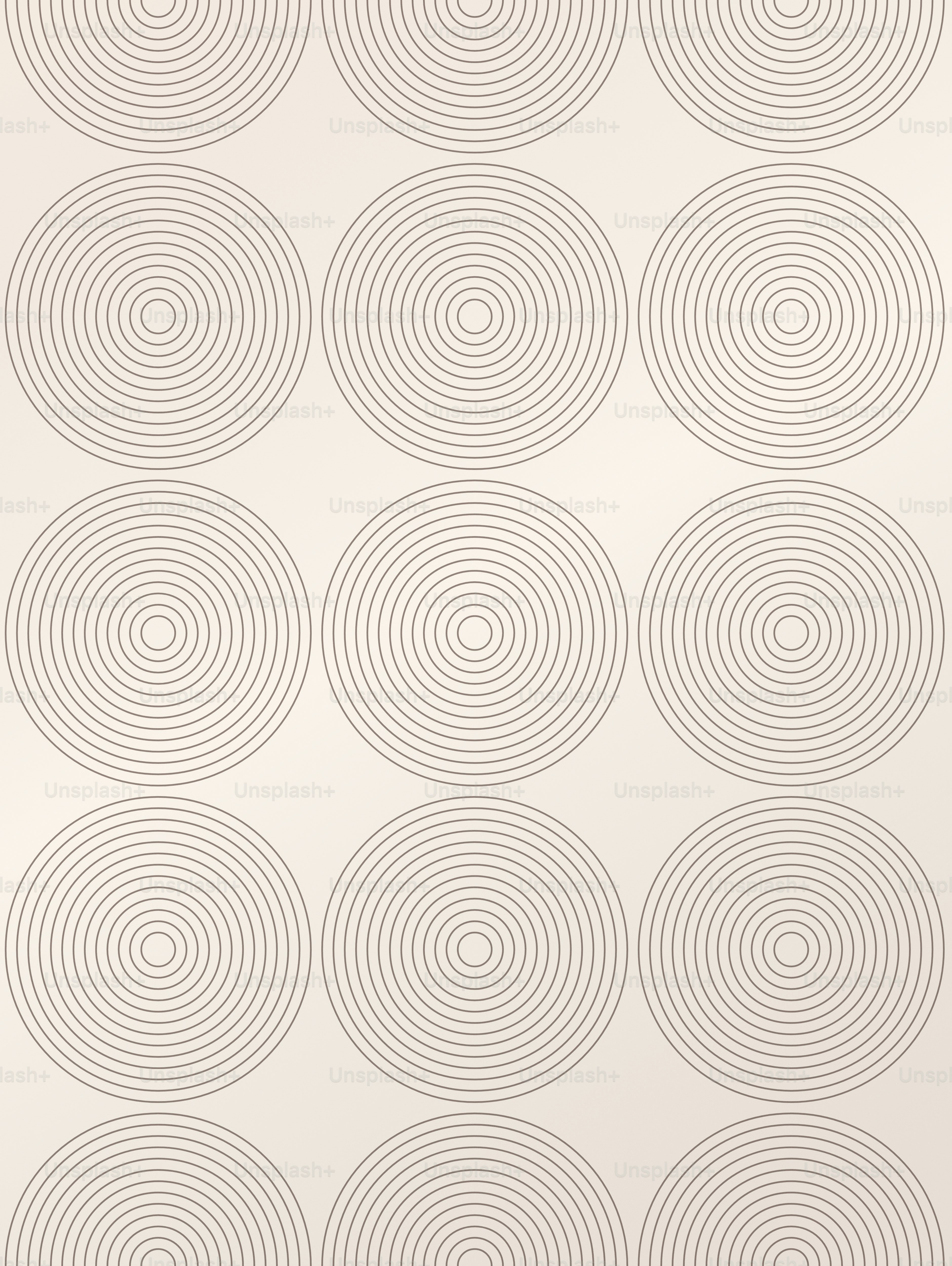 A repeating pattern of thin dark brown concentric circles on a cream background.
