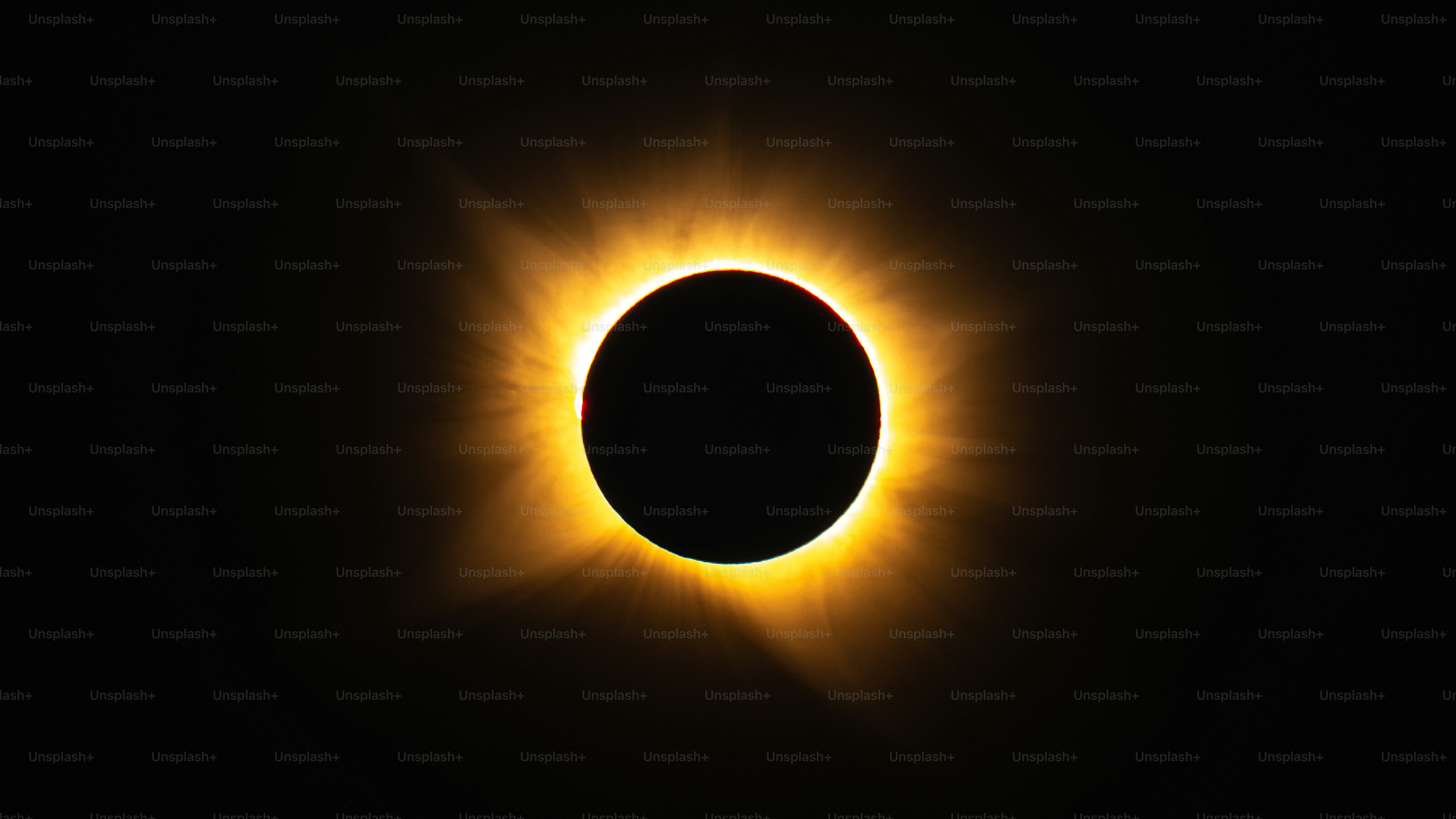 A total solar eclipse with a glowing corona against a dark sky